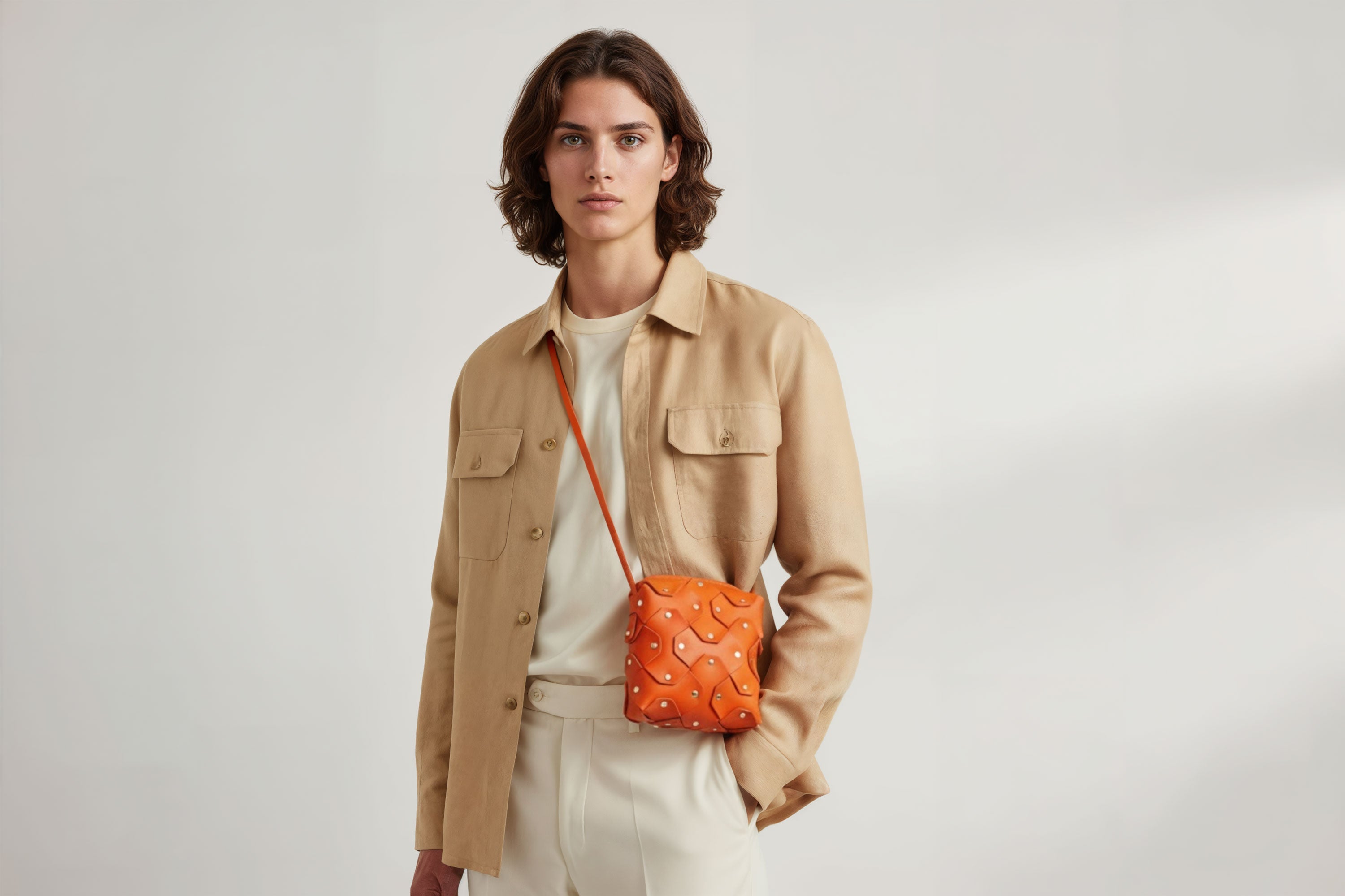 Rivet Bag Squared Orange Colour Leather Bag On a Man Model Minimalist Modern Design Premium Quality Atelier Madre Manuel Dreesmann Barcelona