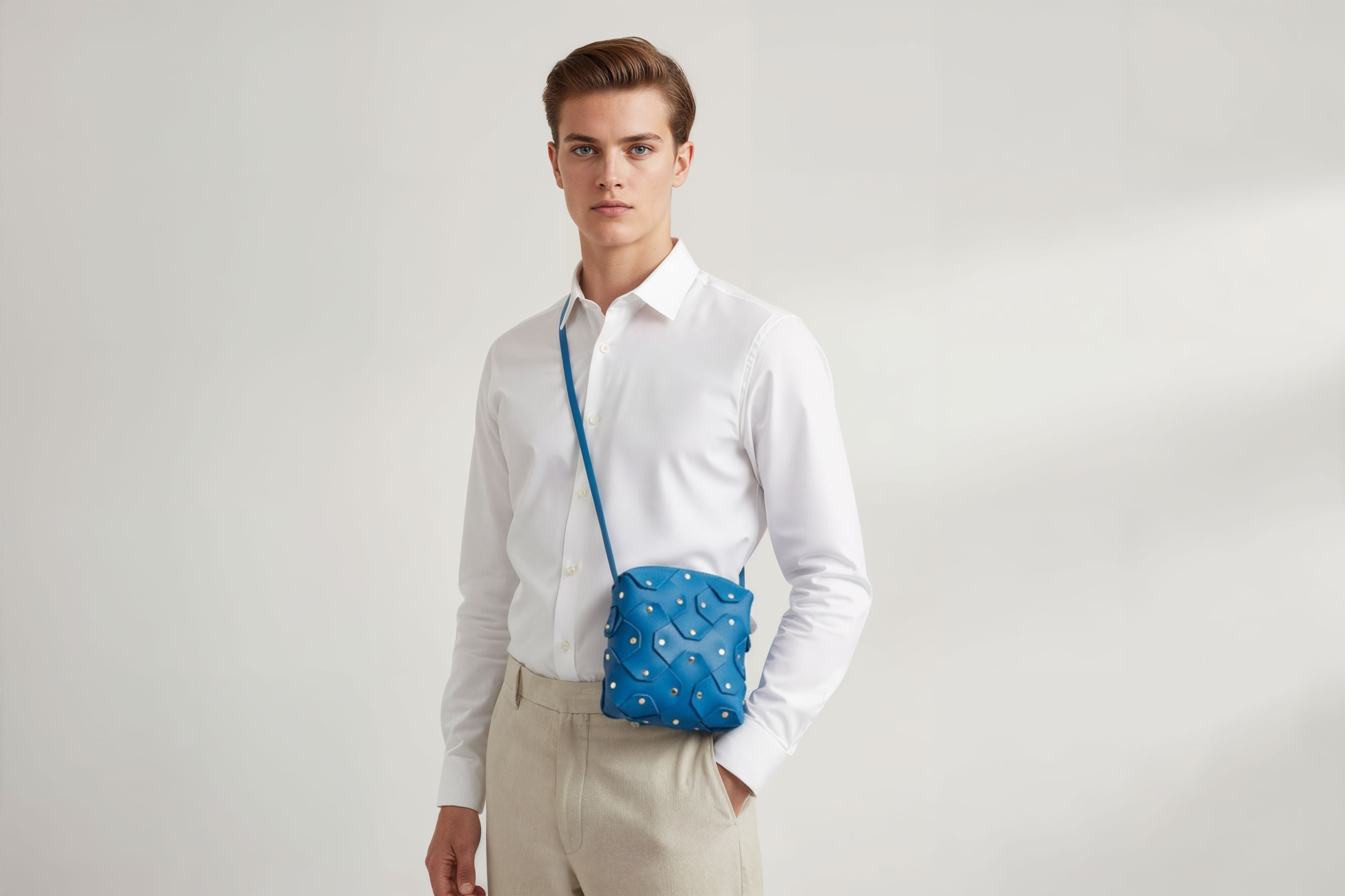 Rivet Bag Squared Royal Blue Colour On A Man Model Leather Bag Minimalist Modern Design Premium Quality Atelier Madre Manuel Dreesmann Barcelona