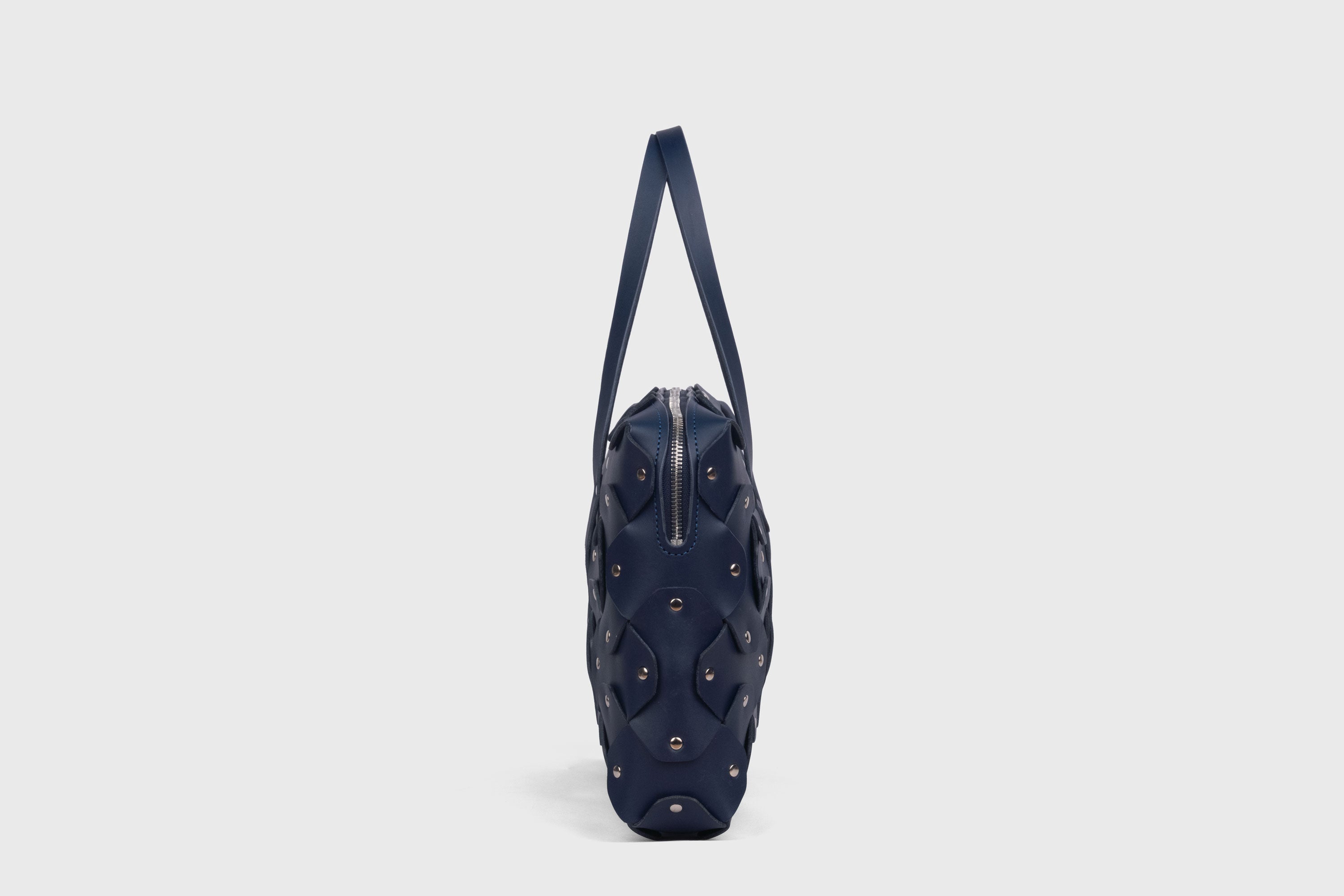 Rivet Briefcase In Marine Blue Color In Vegetable Tanned Leather With Brass Rivets Unique Design Atelier Madre Manuel Dreesmann Barcelona Spain