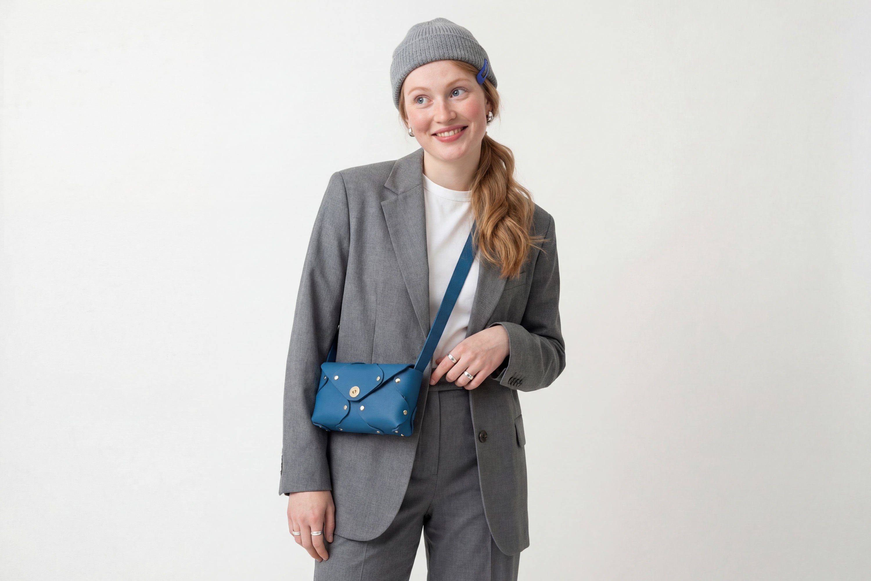 Tamara Bag Royal Blue Color On A Woman Model Leather Vegetable Tanned Leather Minimalist Modern Design Rivets Brass Premium Shoulderbag Atelier Madre Manuel Dreesmann Barcelona Spain