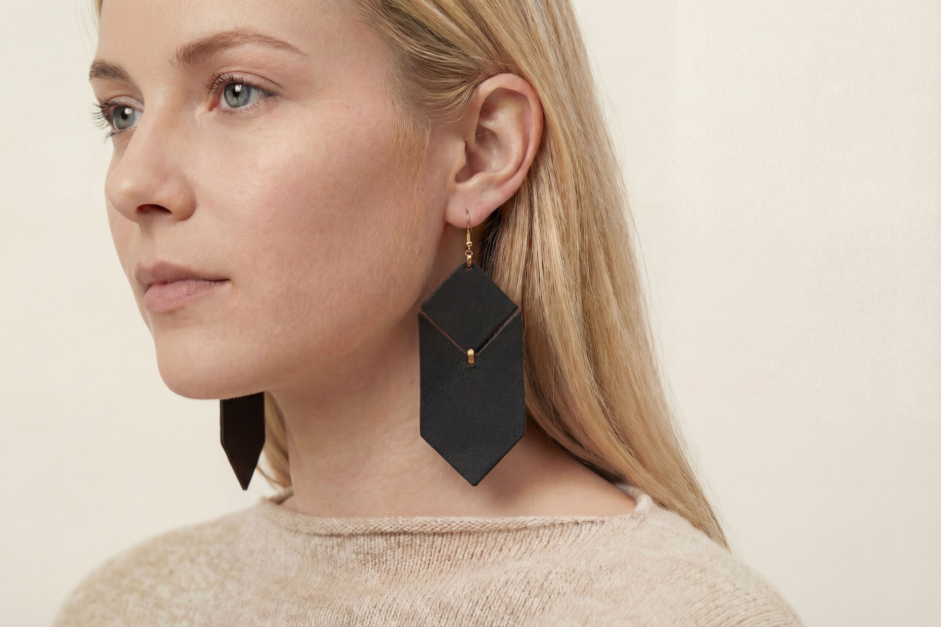 Tess Earrings Leather In Black Color On Model Vegetable Tanned Leather Minimalistic Design Atelier Madre Manuel Dreesmann Barcelona Spain