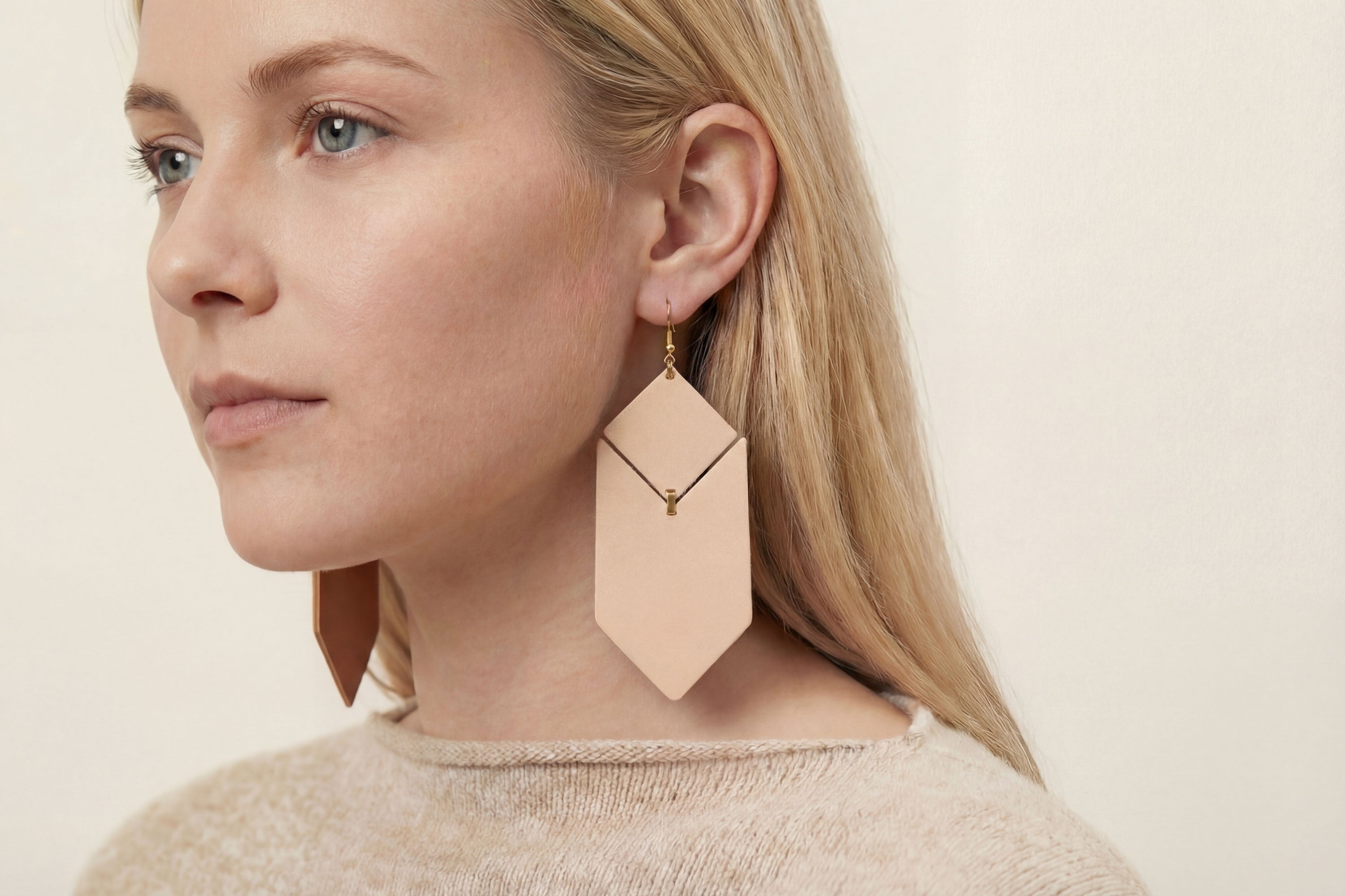 Tess Earrings Leather In Natural Color On Model Vegetable Tanned Leather Minimalistic Design Atelier Madre Manuel Dreesmann Barcelona Spain