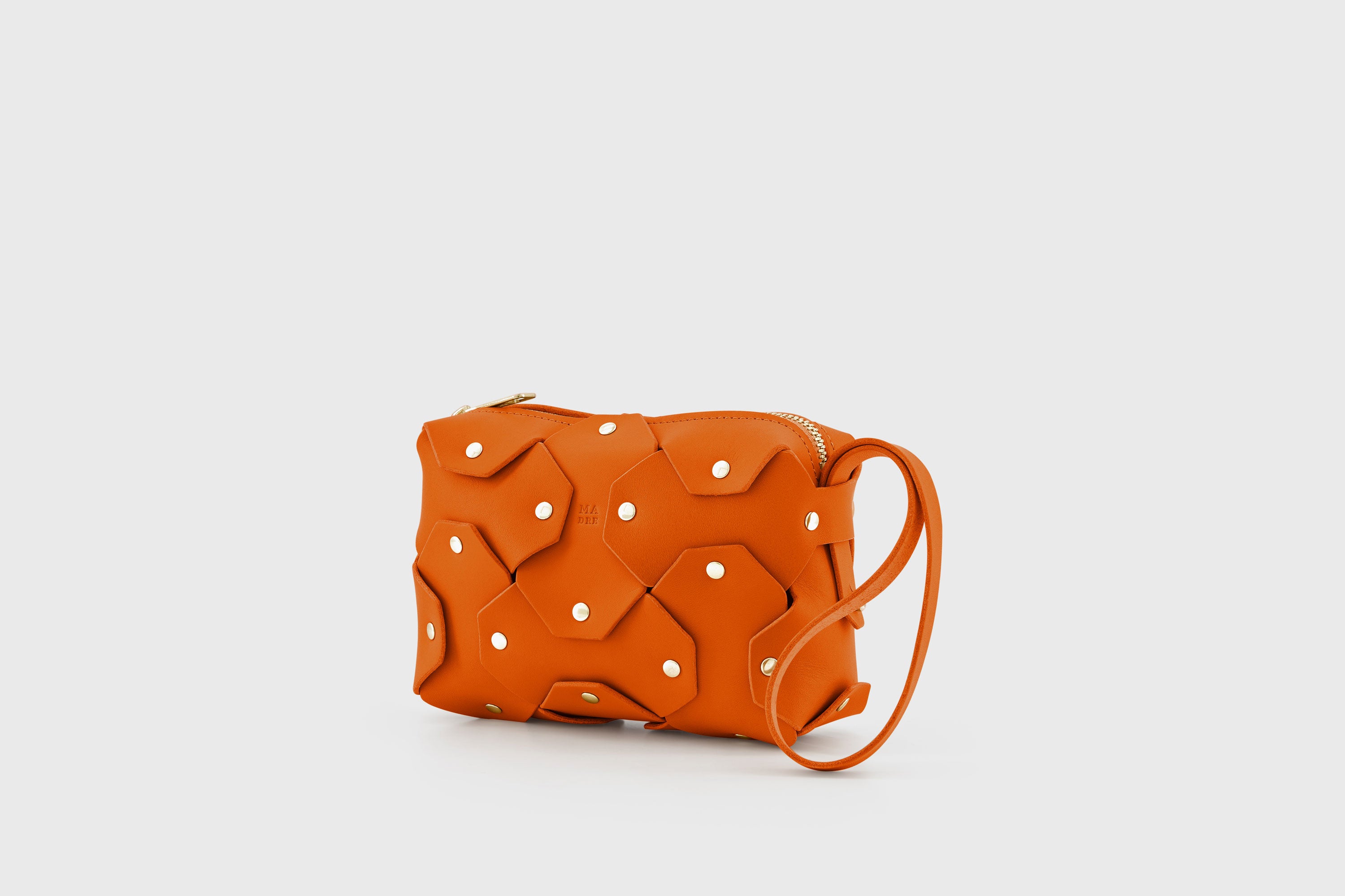 Rivet Bag Small Leather Orange Color Clutch Crossbody Shoulder Detachable Full Brass Vegetable Tanned Full Grain Leather High Quality Modern Minimalistic Design Atelier Madre Manuel Dreesmann Barcelona Spain