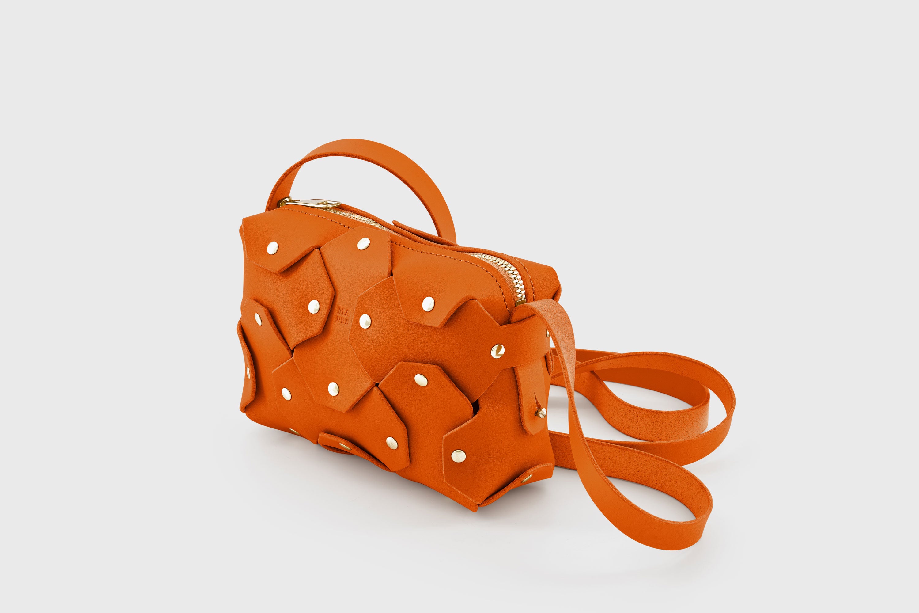 Rivet Bag Small Leather Orange Color Clutch Crossbody Shoulder Detachable Full Brass Vegetable Tanned Full Grain Leather High Quality Modern Minimalistic Design Atelier Madre Manuel Dreesmann Barcelona Spain