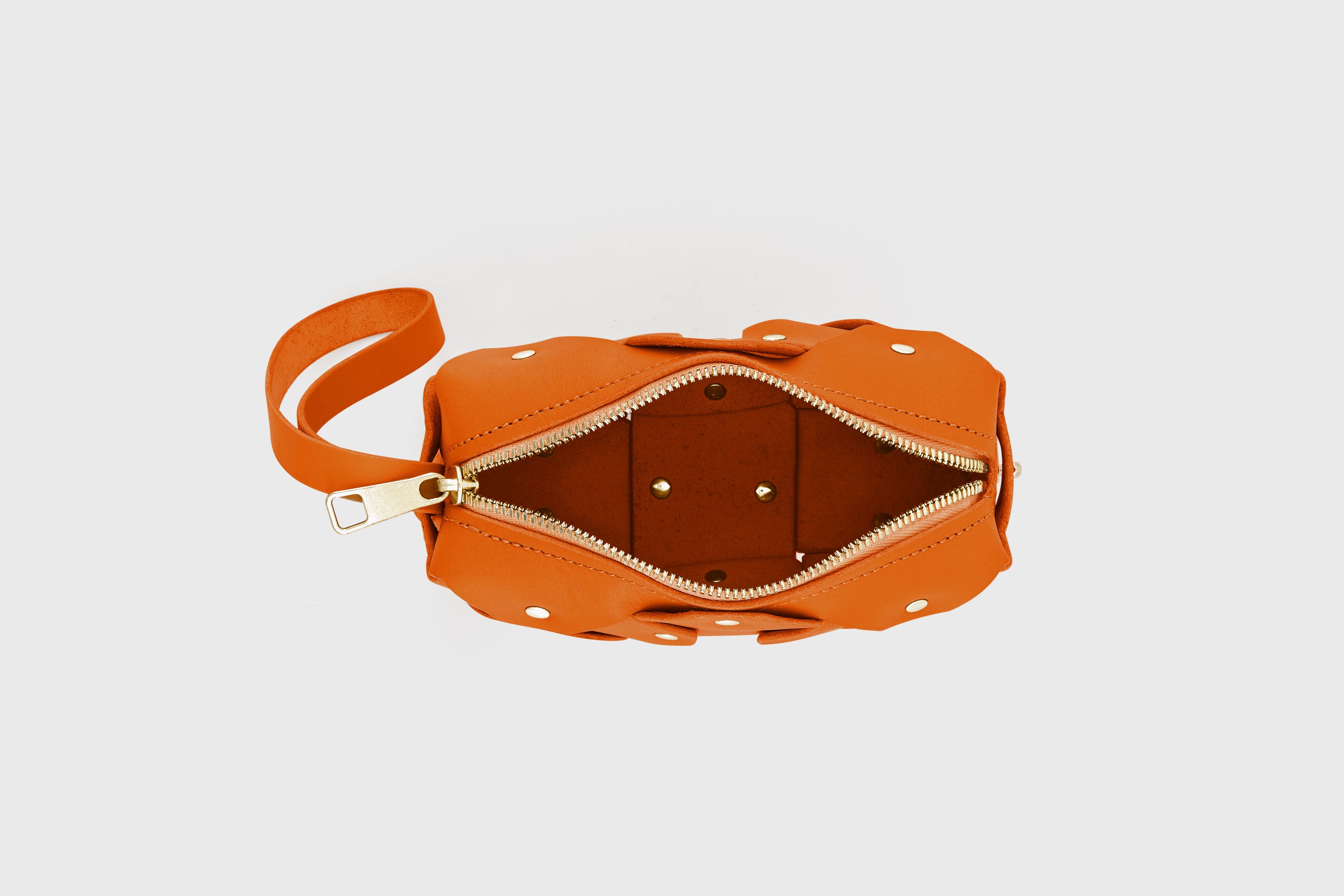 Rivet Bag Small Leather Orange Color Clutch Crossbody Shoulder Detachable Full Brass Vegetable Tanned Full Grain Leather High Quality Modern Minimalistic Design Atelier Madre Manuel Dreesmann Barcelona Spain