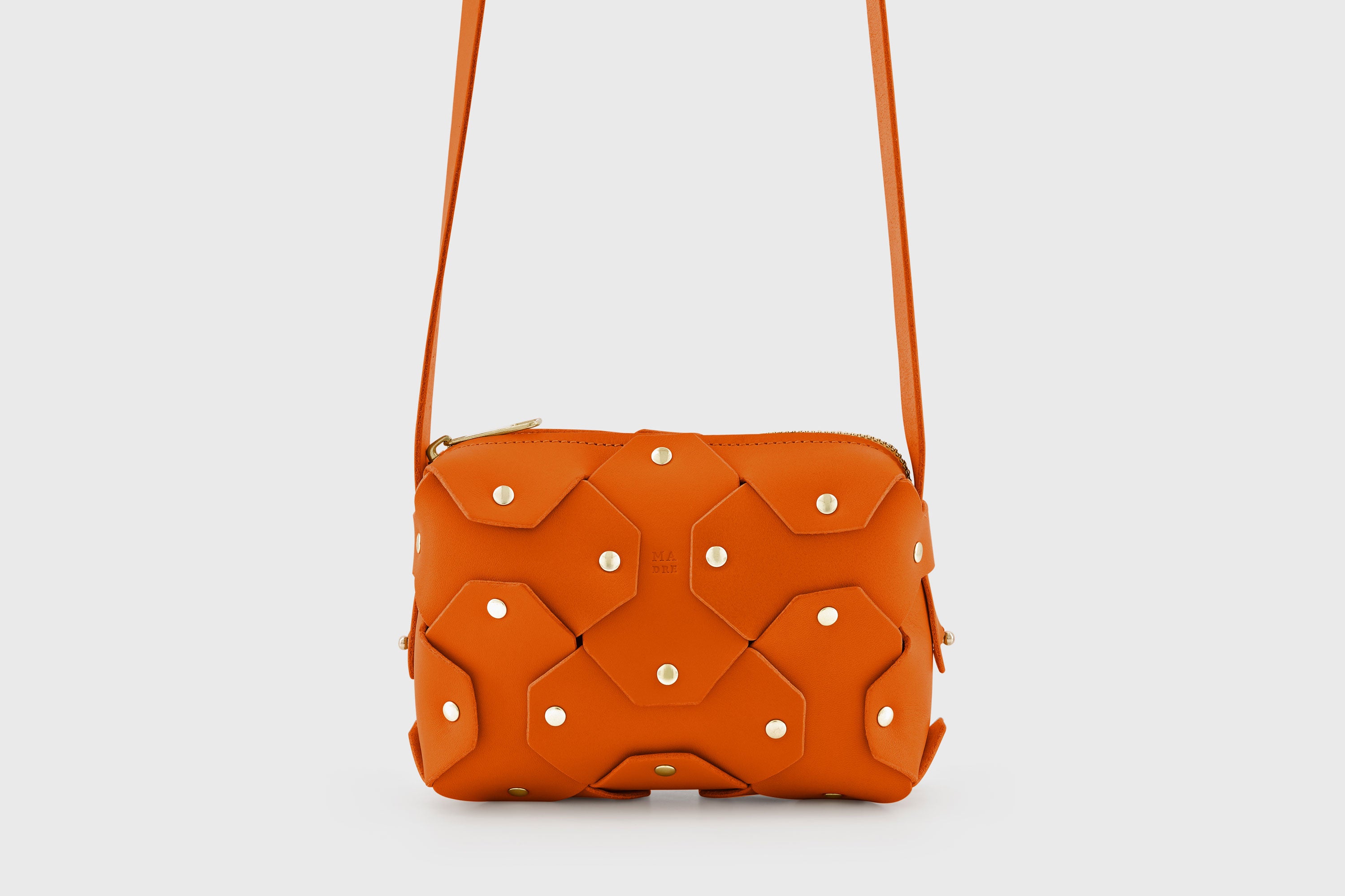 Rivet Bag Small Leather Orange Color Clutch Crossbody Shoulder Detachable Full Brass Vegetable Tanned Full Grain Leather High Quality Modern Minimalistic Design Atelier Madre Manuel Dreesmann Barcelona Spain