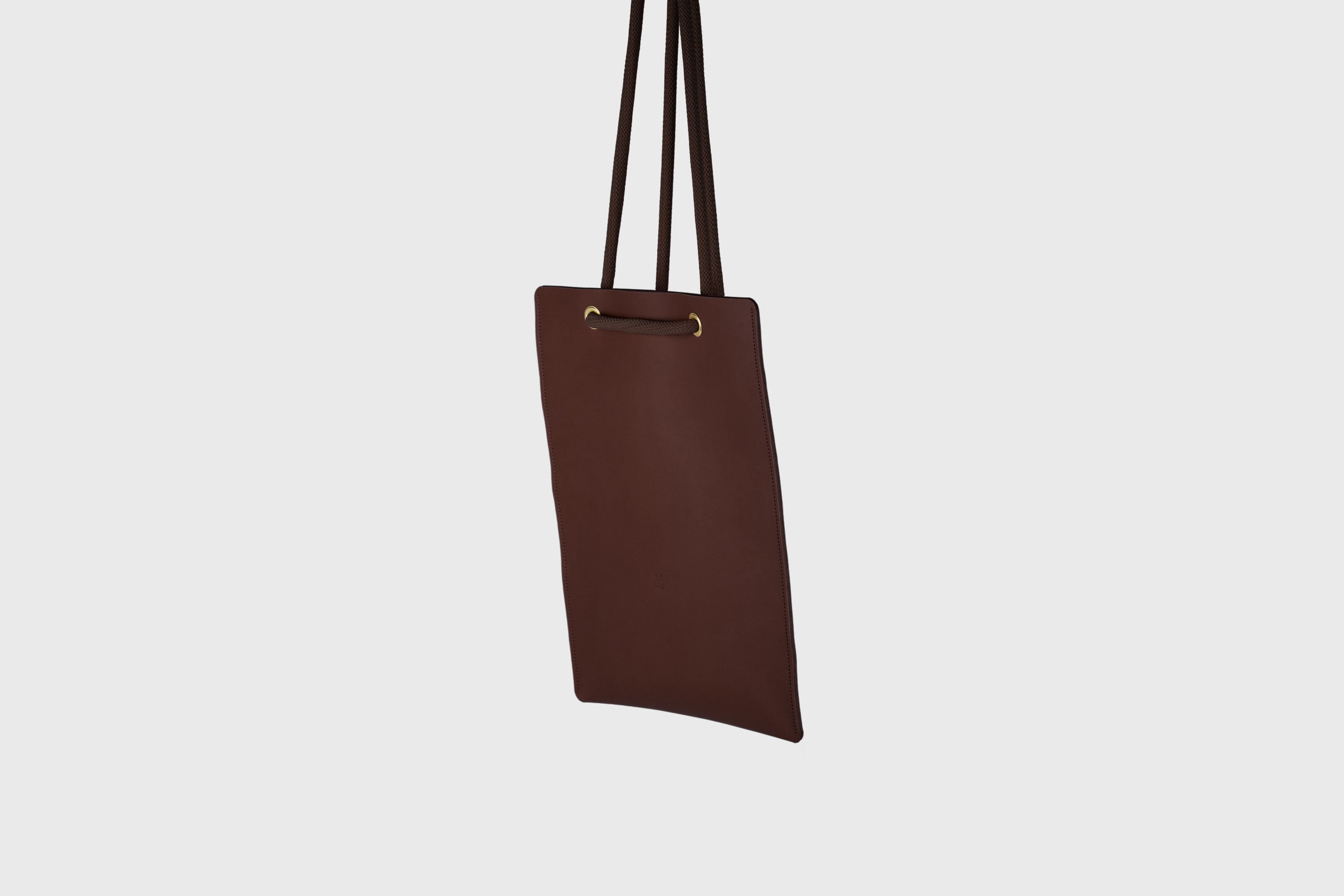Tote Backpack Premium Leather Dark Brown Color Rope Handles Minimalist Design Atelier Madre Manuel Dreesmann Barcelona Spain