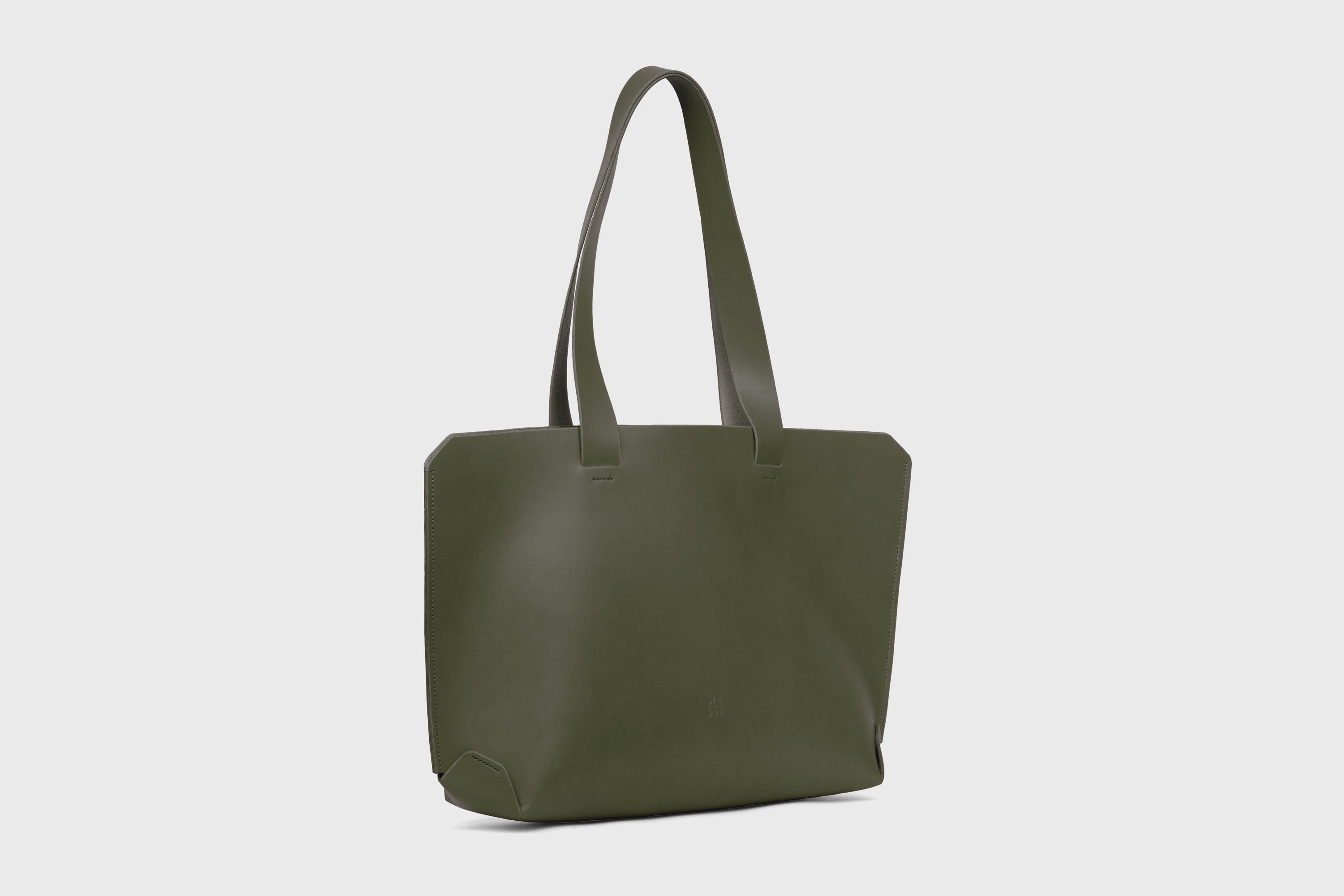Tote Bag Leather Olive Green Color On A Woman Model Vegetable Tanned Leather Natural Minimalistic Design By Manuel Dreesmann Atelier Madre Barcelona Spain