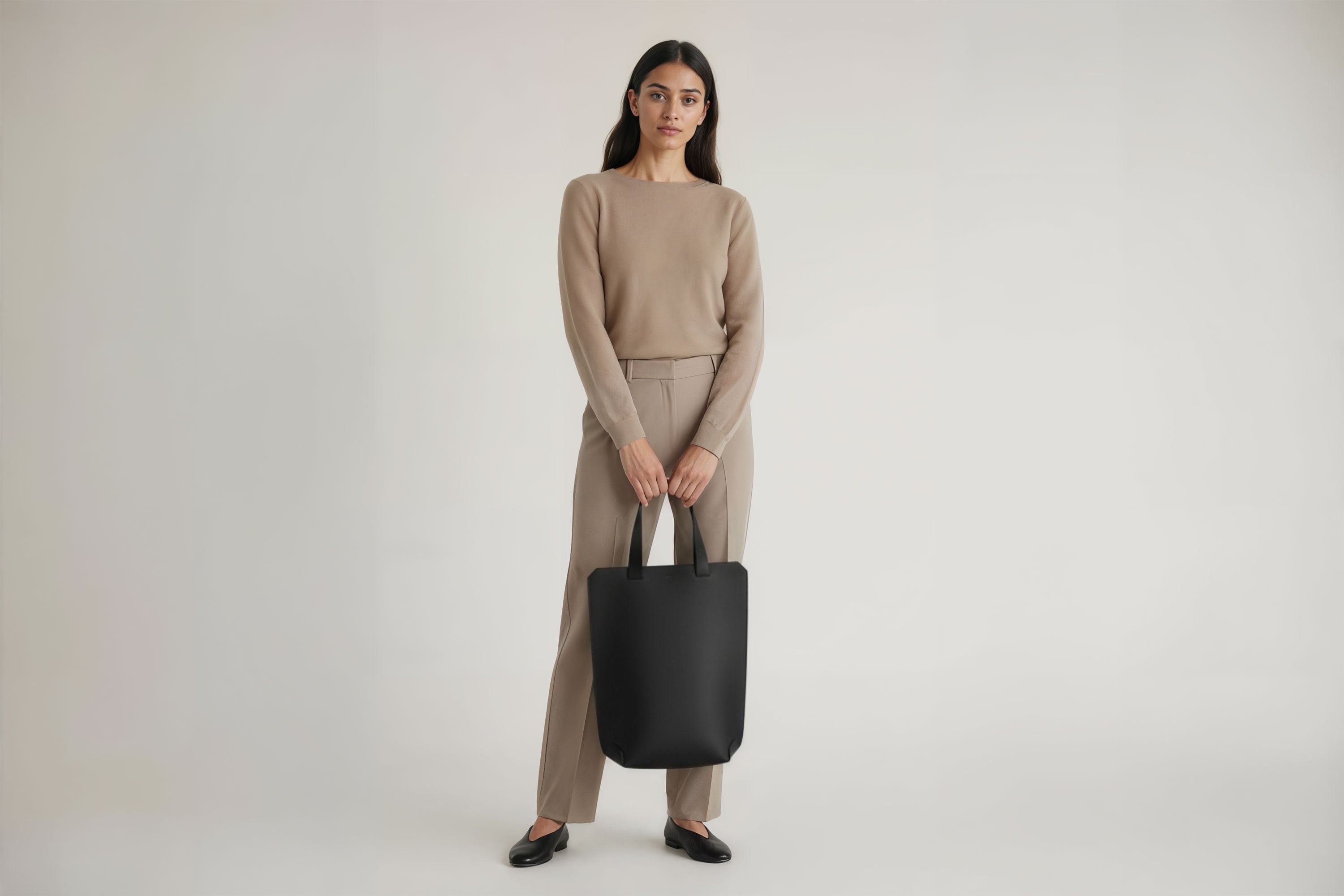 Tote Bag Long Black Color Leather Bag On A Woman Model Vegetable Tanned Leather Exclusive Quality Craftsmanship Handmade Design By Manuel Dreesmann Atelier Madre Barcelona Spain