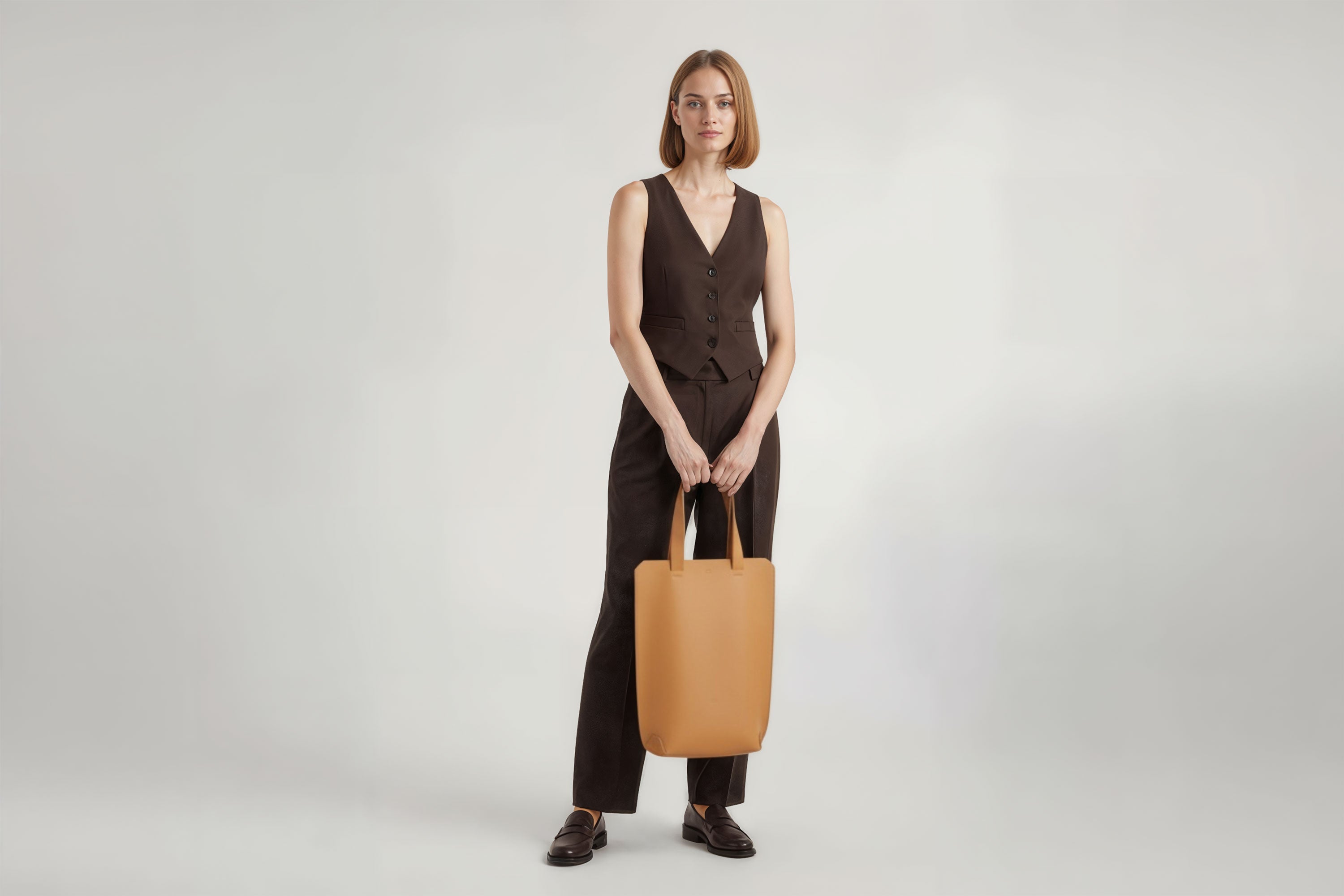 Tote Bag Long Brown Color Leather Bag On A Woman Model Vegetable Tanned Leather Exclusive Quality Craftsmanship Handmade Design By Manuel Dreesmann Atelier Madre Barcelona Spain