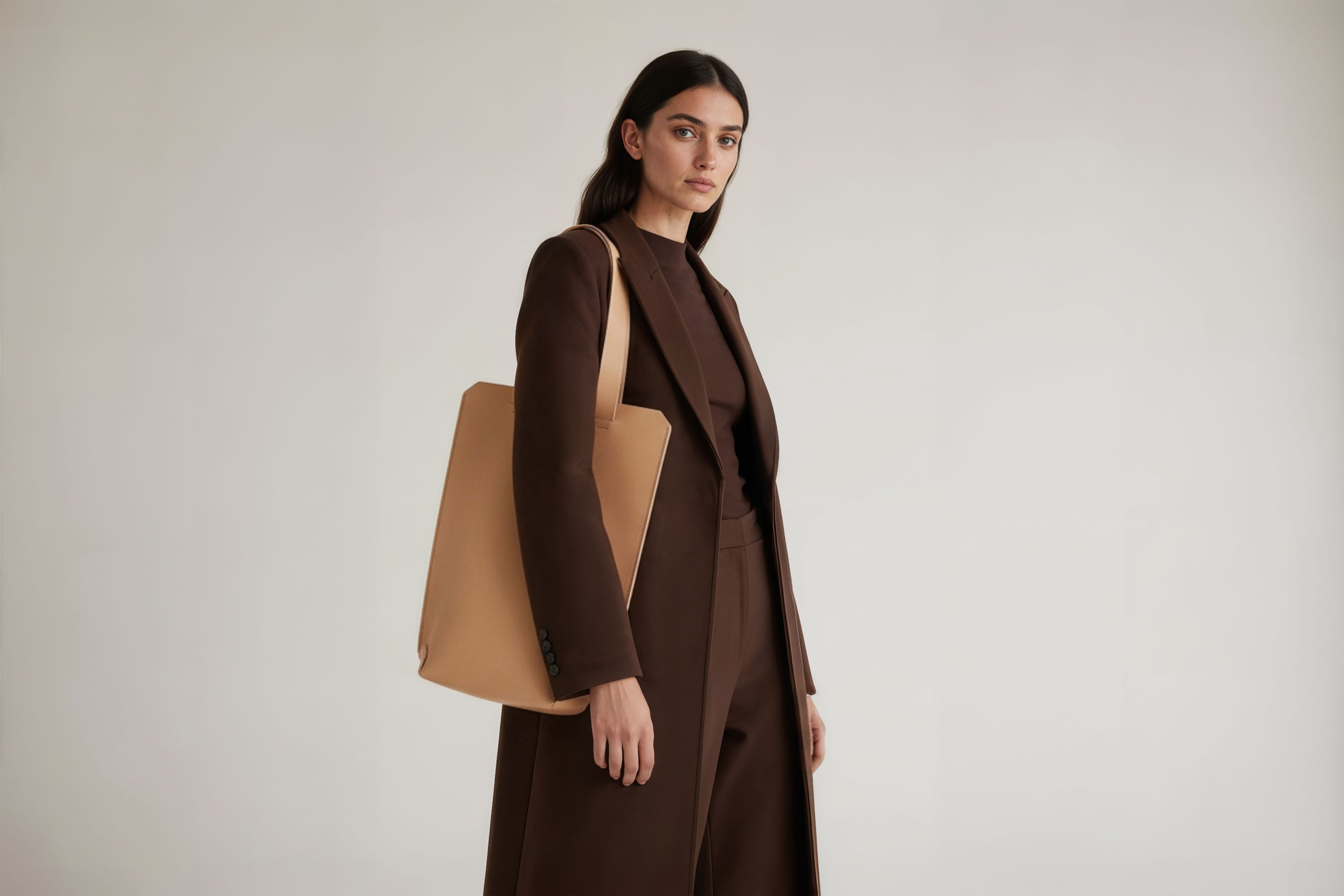 Tote Bag Long Natural Color Leather Bag On A Woman Model Vegetable Tanned Leather Exclusive Quality Craftsmanship Handmade Design By Manuel Dreesmann Atelier Madre Barcelona Spain