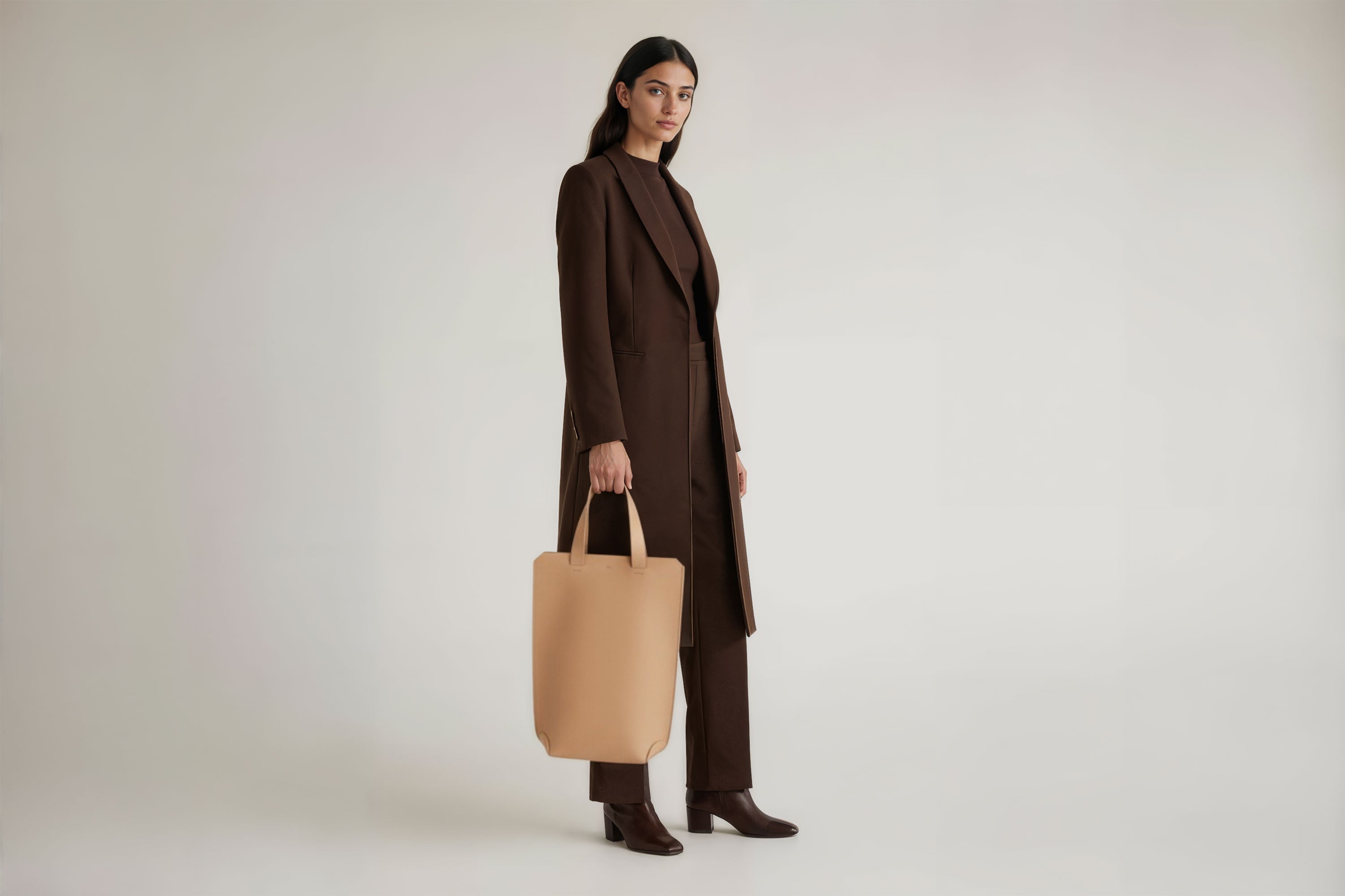 Tote Bag Long Natural Color Leather Bag On A Woman Model Vegetable Tanned Leather Exclusive Quality Craftsmanship Handmade Design By Manuel Dreesmann Atelier Madre Barcelona Spain