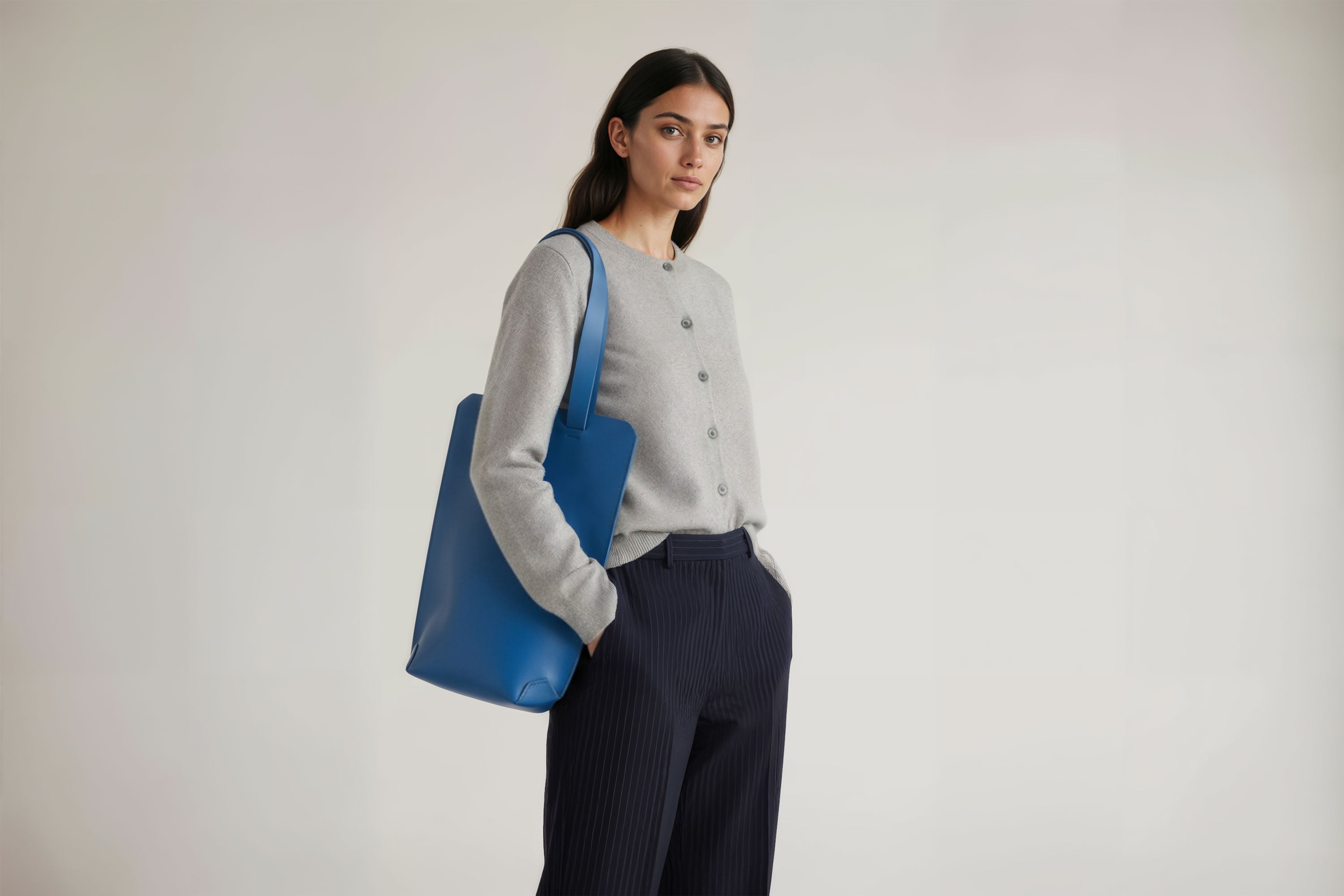 Tote Bag Long Royal Blue Leather Bag On A Woman Model Vegetable Tanned Leather Exclusive Quality Craftsmanship Handmade Design By Manuel Dreesmann Atelier Madre Barcelona Spain