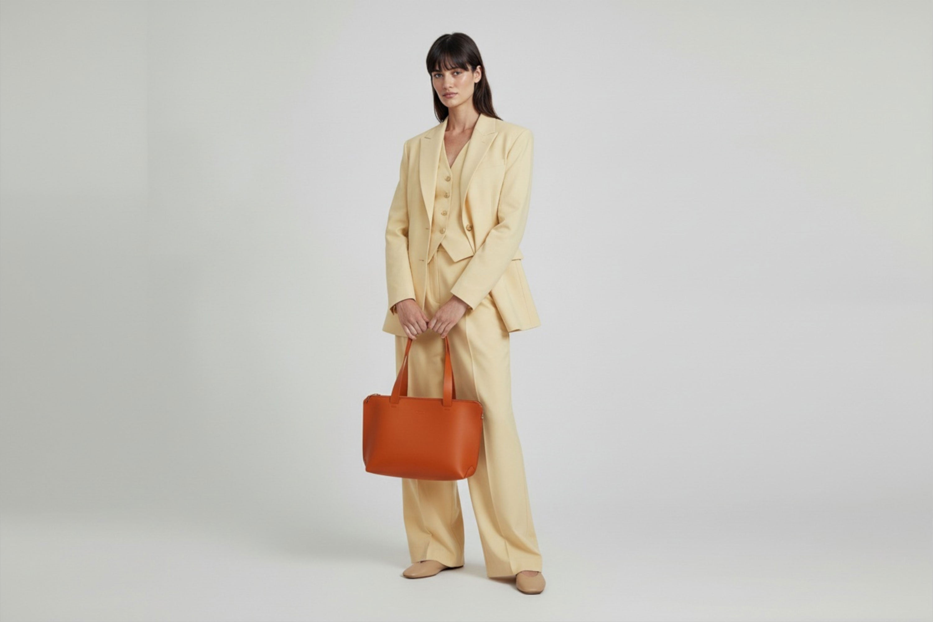 Tote Bag Leather Zipper Orange Color On A Woman Model Premium Quality Minimalist Design Atelier Madre Manuel Dreesmann Barcelona Spain
