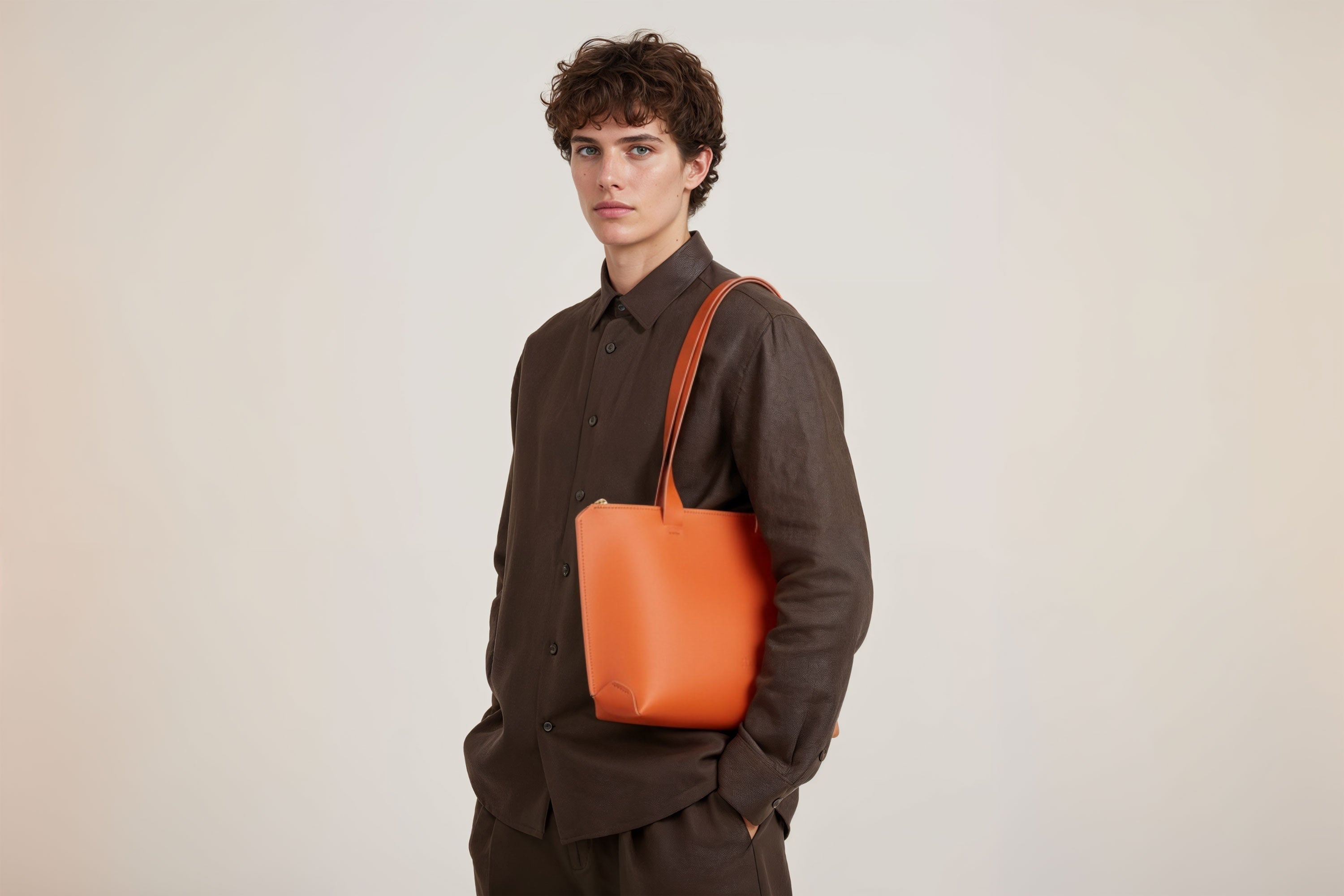 Tote Bag Leather Zipper Orange Color On A Man Model Premium Quality Minimalist Design Atelier Madre Manuel Dreesmann Barcelona Spain