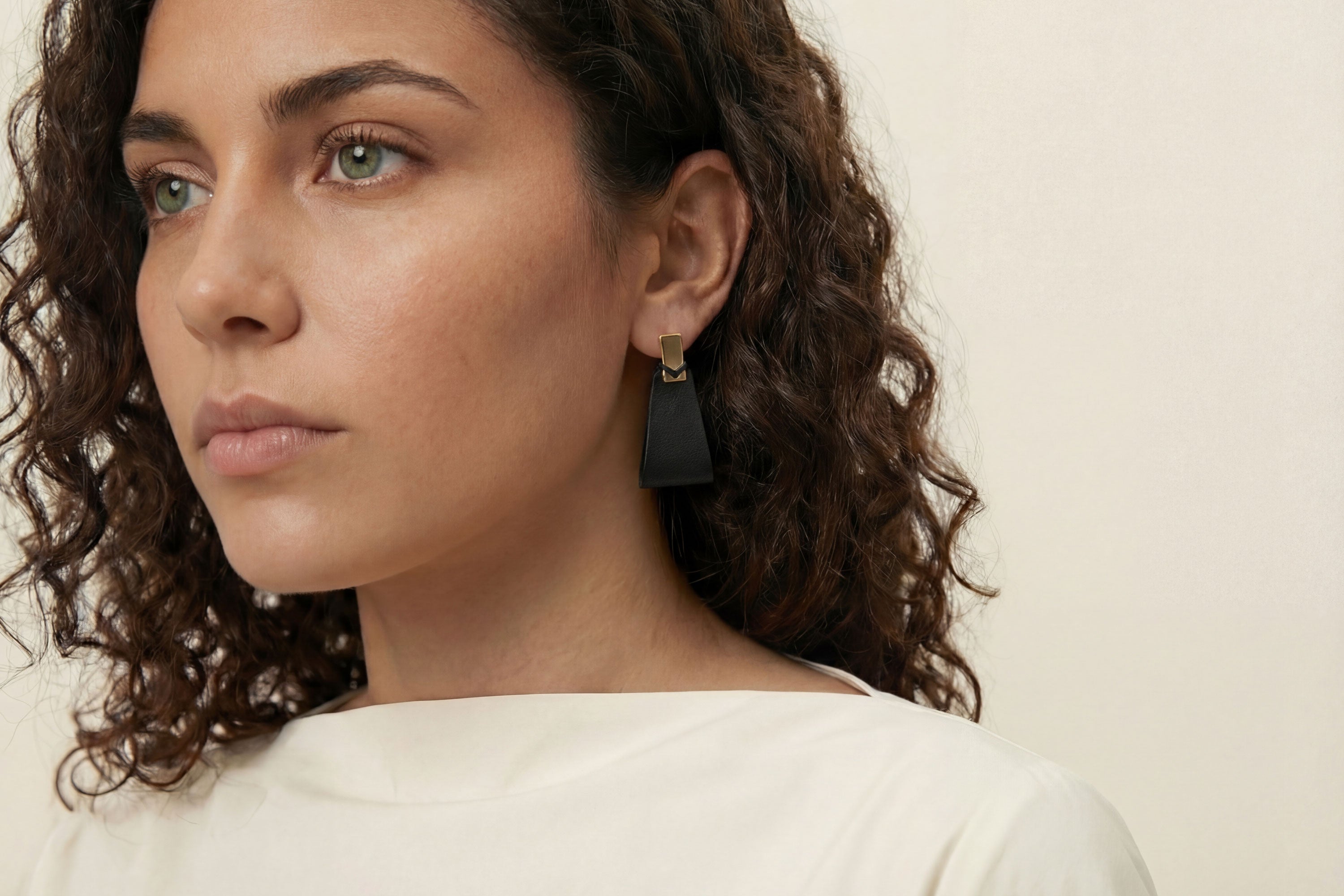 Valeria Earrings In Black Color On Model Vegetable Tanned Leather Geometric Minimalistic Design Atelier Madre Manuel Dreesmann Barcelona Spain