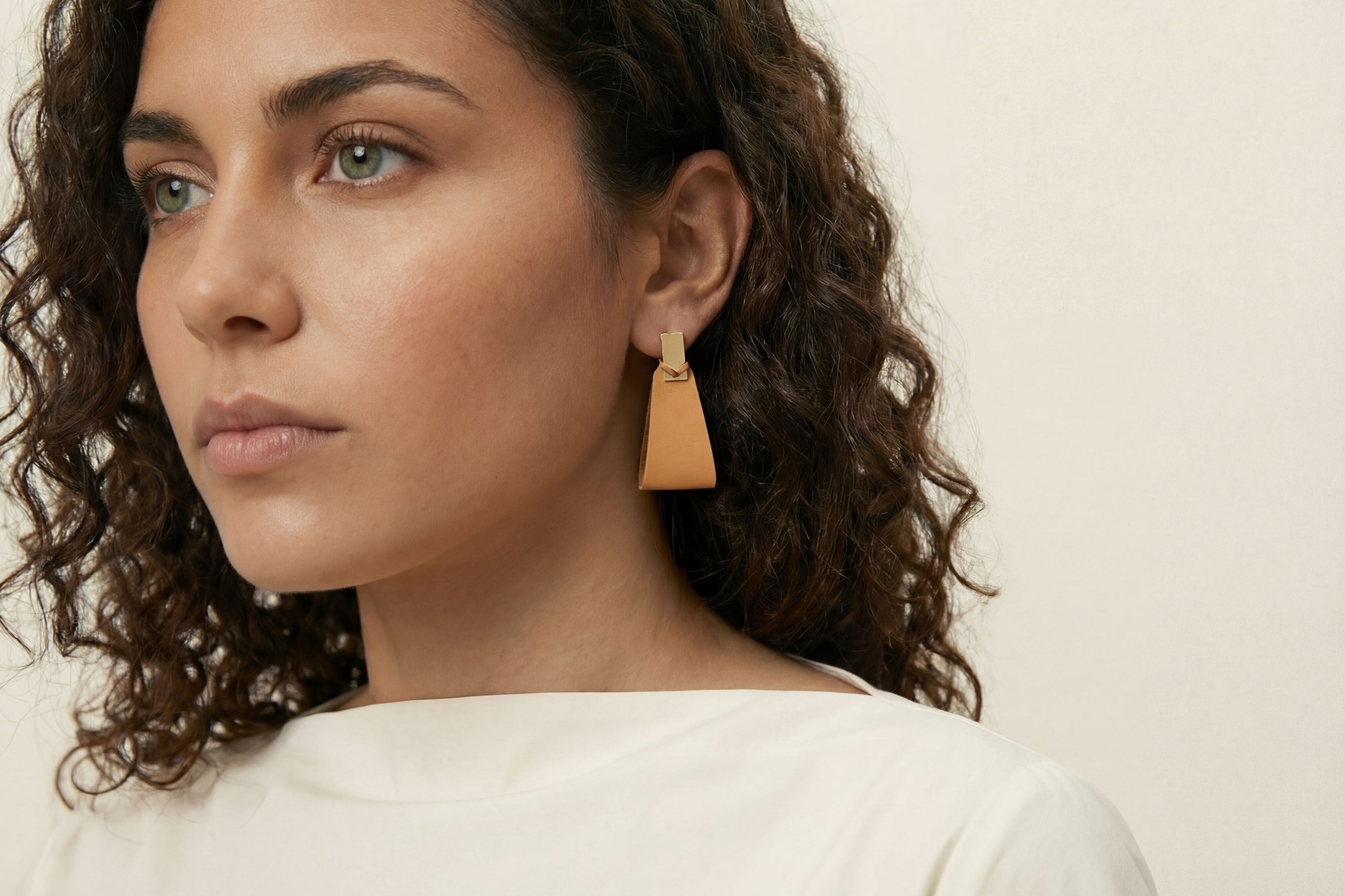Valeria Earrings In Brown Color On Model Vegetable Tanned Leather Geometric Minimalistic Design Atelier Madre Manuel Dreesmann Barcelona Spain