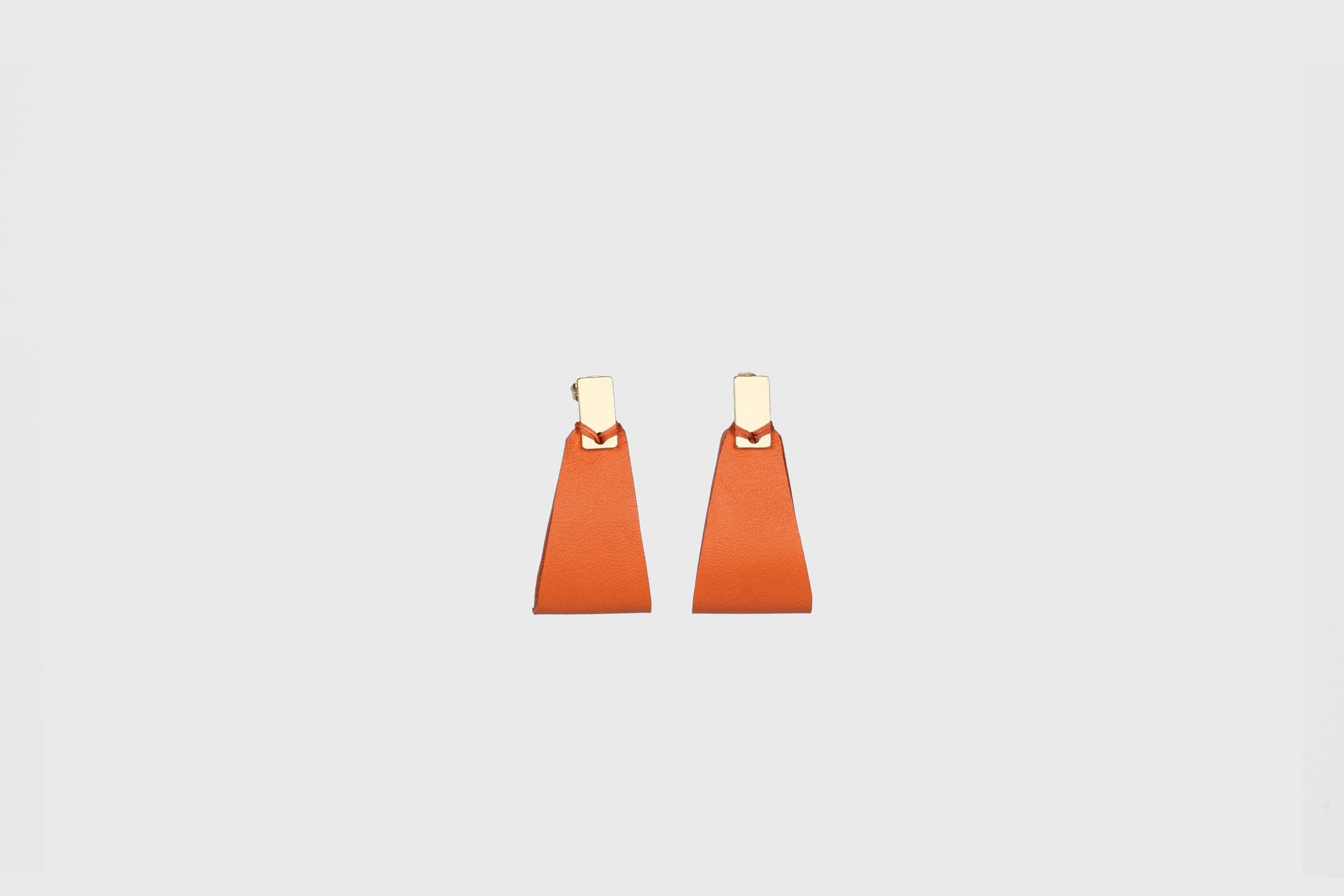 Valeria Earrings In Orange Color Vegetable Tanned Leather Geometric Minimalistic Design Atelier Madre Manuel Dreesmann Barcelona Spain