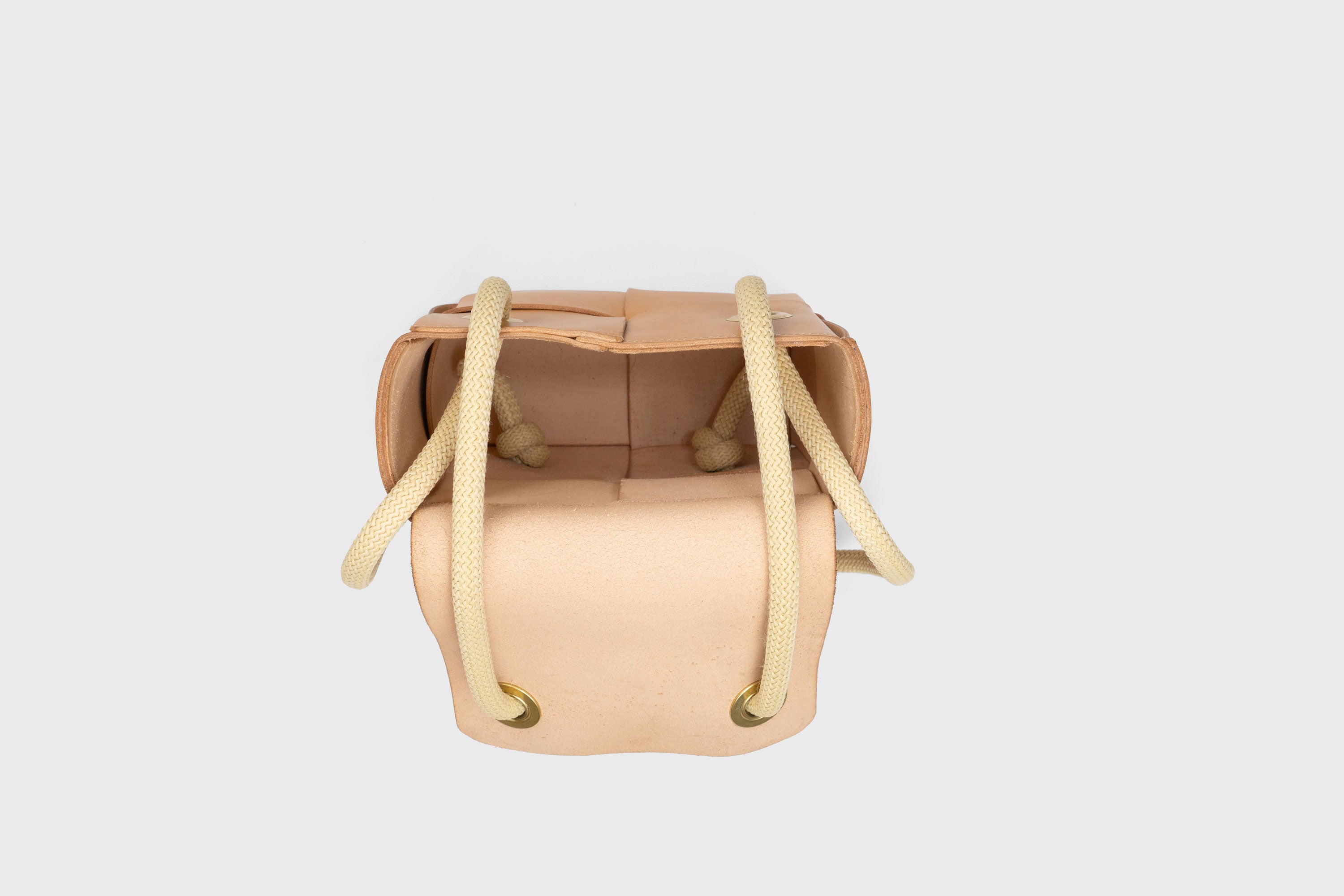 Elegant Atelier Madre Brown woven leather backpack, designed by Manuel Dreesmann, showcasing exquisite craftsmanship and luxury style, crafted in the heart of Barcelona.