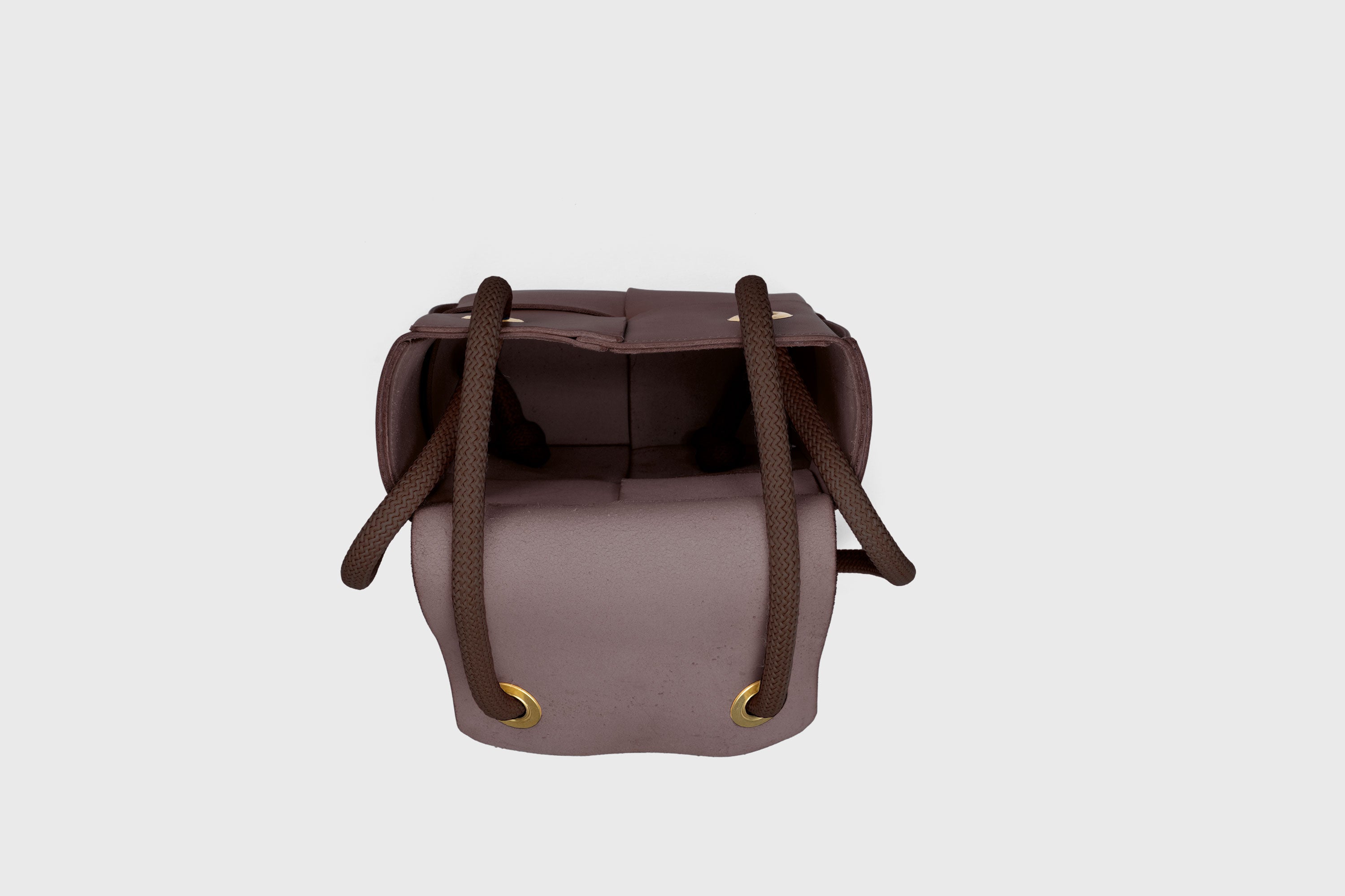 Elegant Atelier Madre Dark Brown Color woven leather backpack, designed by Manuel Dreesmann, showcasing exquisite craftsmanship and luxury style, crafted in the heart of Barcelona.