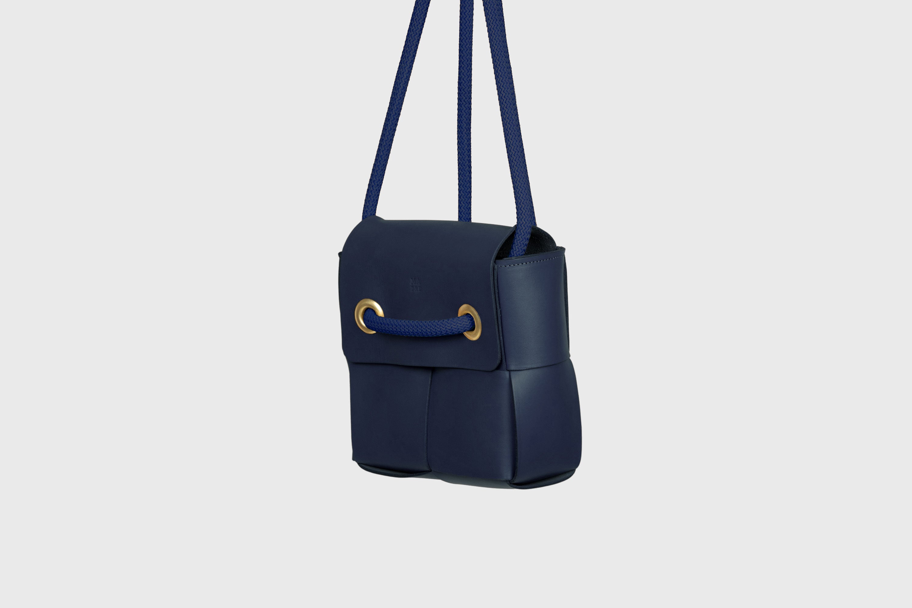 Elegant Atelier Madre Marine Blue Color woven leather backpack, designed by Manuel Dreesmann, showcasing exquisite craftsmanship and luxury style, crafted in the heart of Barcelona.