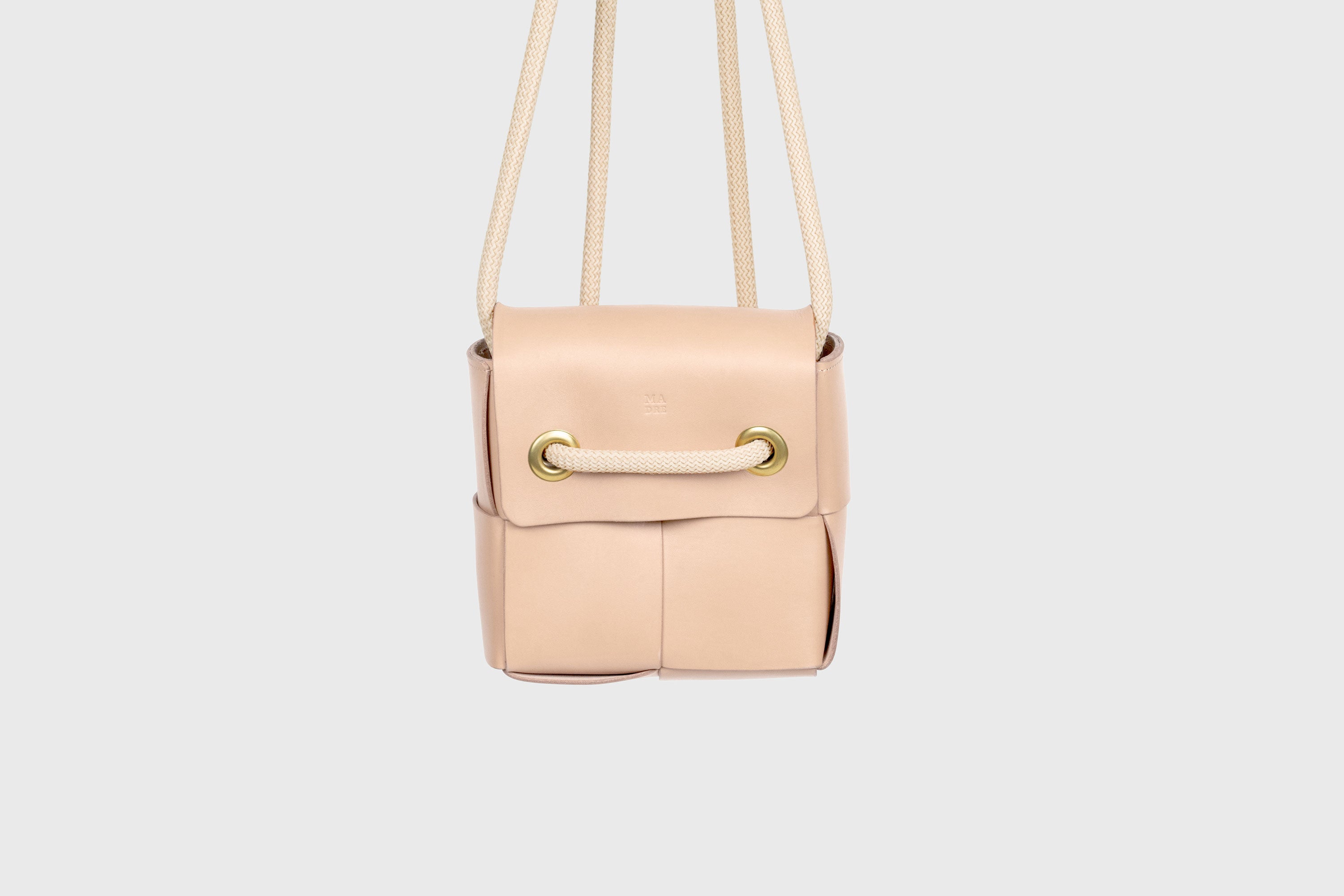 Elegant Atelier Madre Natural Color woven leather backpack, designed by Manuel Dreesmann, showcasing exquisite craftsmanship and luxury style, crafted in the heart of Barcelona.