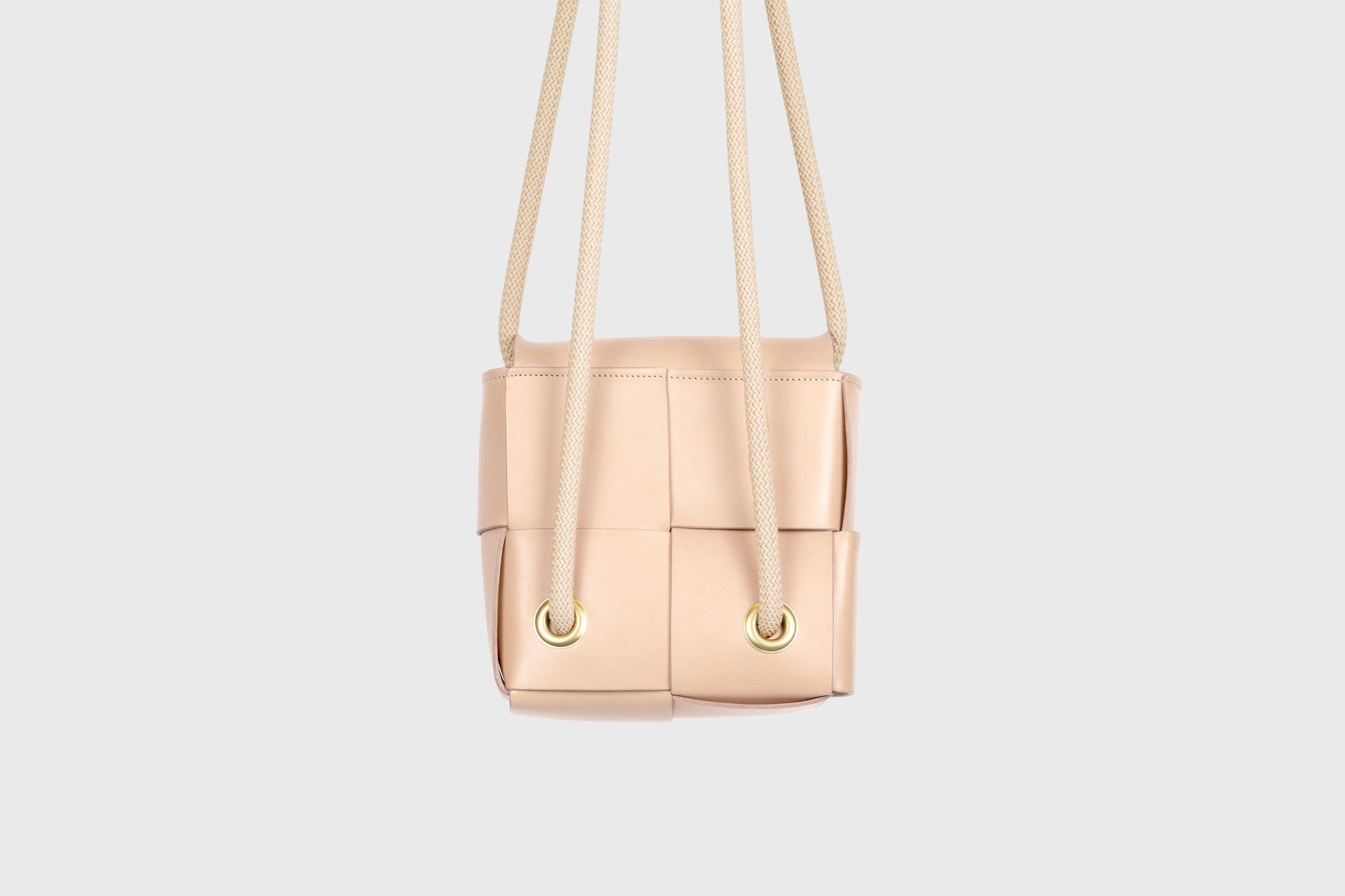 Elegant Atelier Madre Natural Color woven leather backpack, designed by Manuel Dreesmann, showcasing exquisite craftsmanship and luxury style, crafted in the heart of Barcelona.