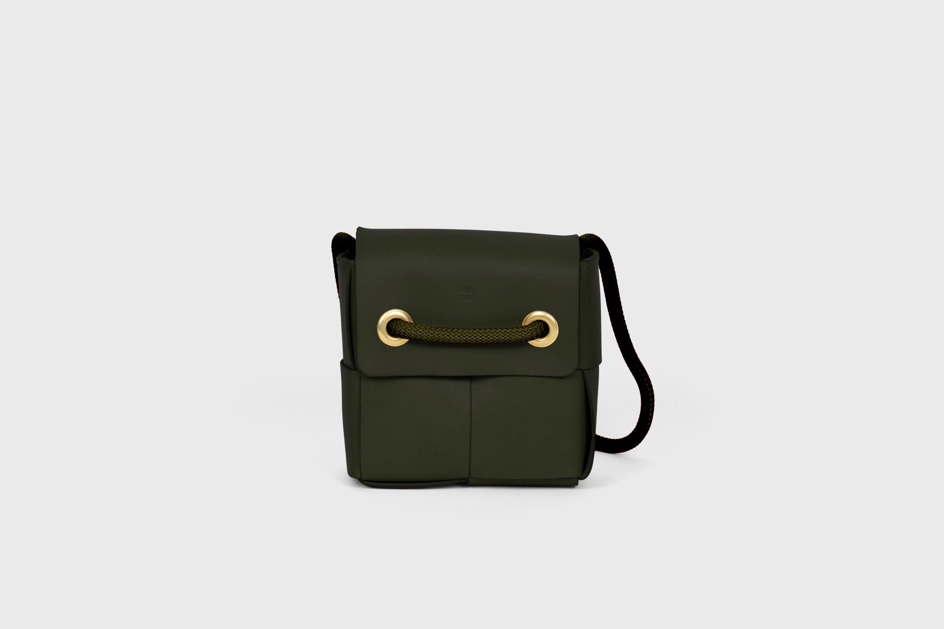 Elegant Atelier Madre Olive Green Color woven leather backpack, designed by Manuel Dreesmann, showcasing exquisite craftsmanship and luxury style, crafted in the heart of Barcelona.