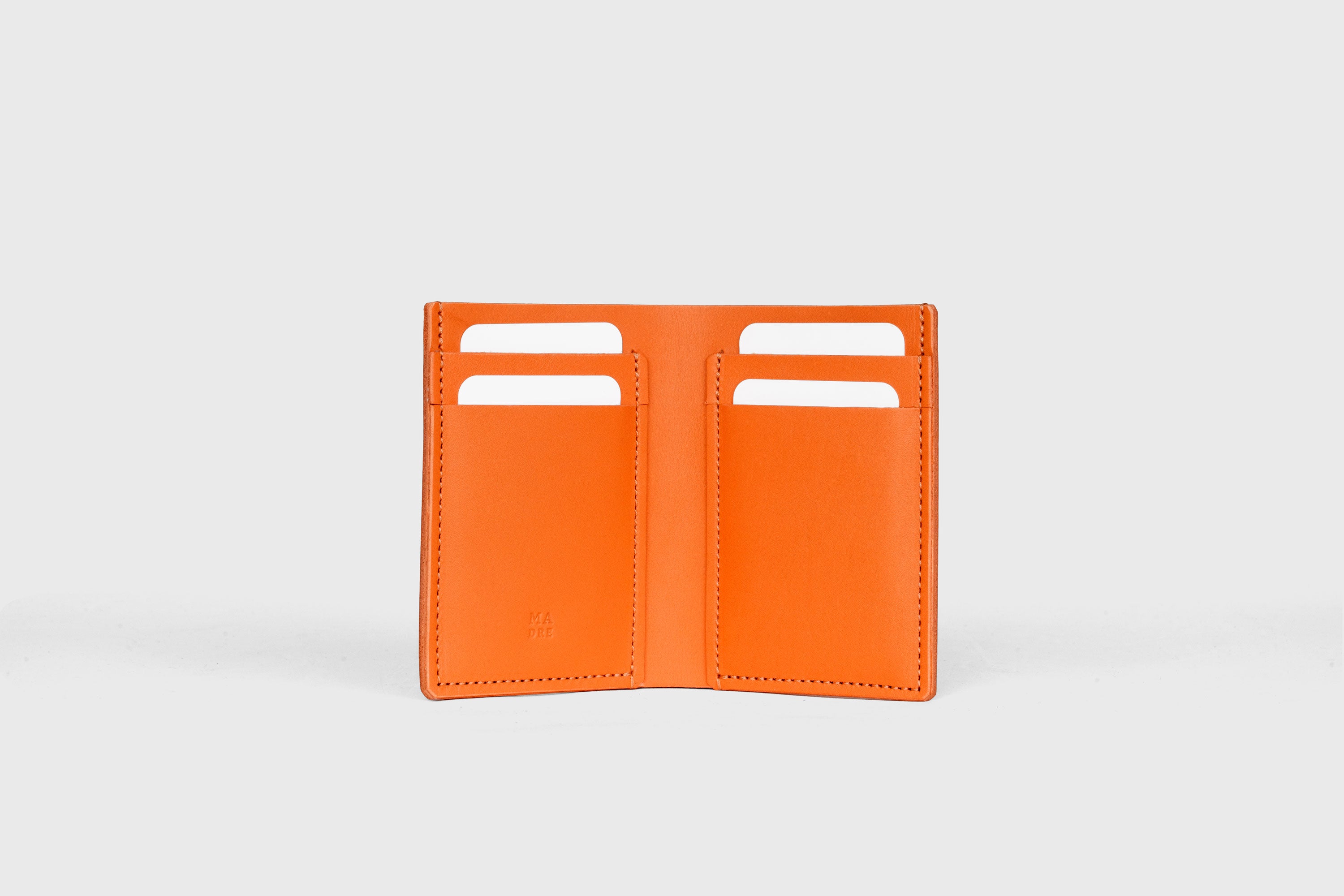 Bifold Wallet Vertical In Orange Color In Vegetable Tanned Leather Minimalistic Slim Design Atelier Madre Manuel Dreesmann Barcelona Spain