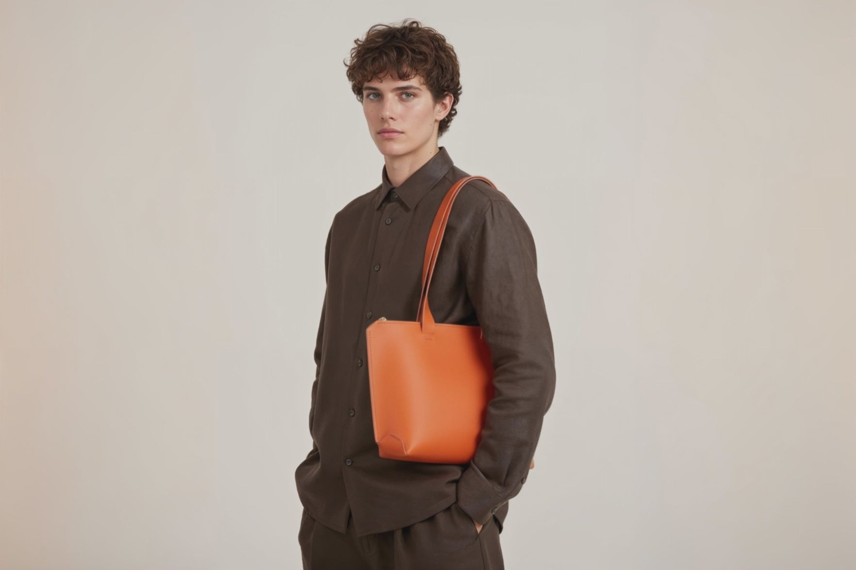 Tote Bag Leather Zipper Orange Color On A Man Model Premium Quality Minimalist Design Atelier Madre Manuel Dreesmann Barcelona Spain