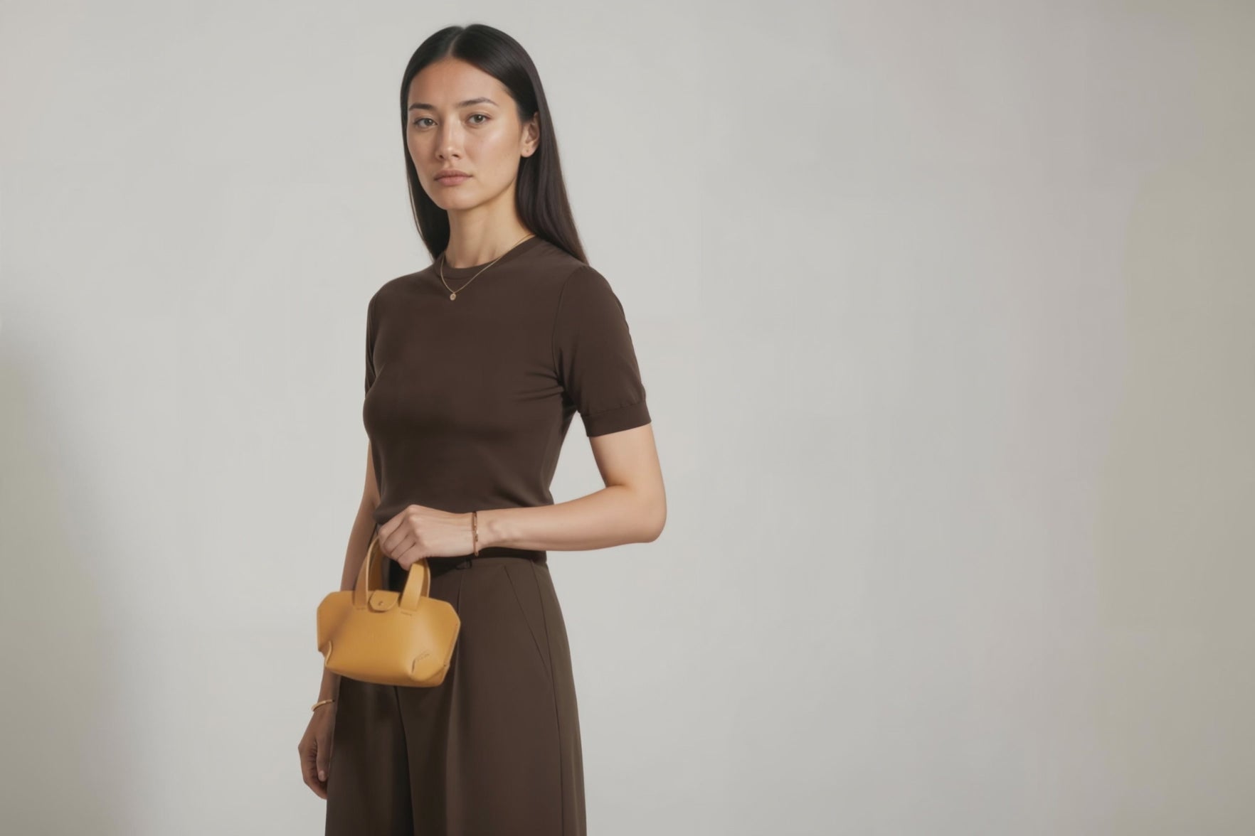 Nano Leather Tote Bag Brown Color On A Woman Model Premium Quality Minimalist Design Atelier Madre Manuel Dreesmann Barcelona Spain