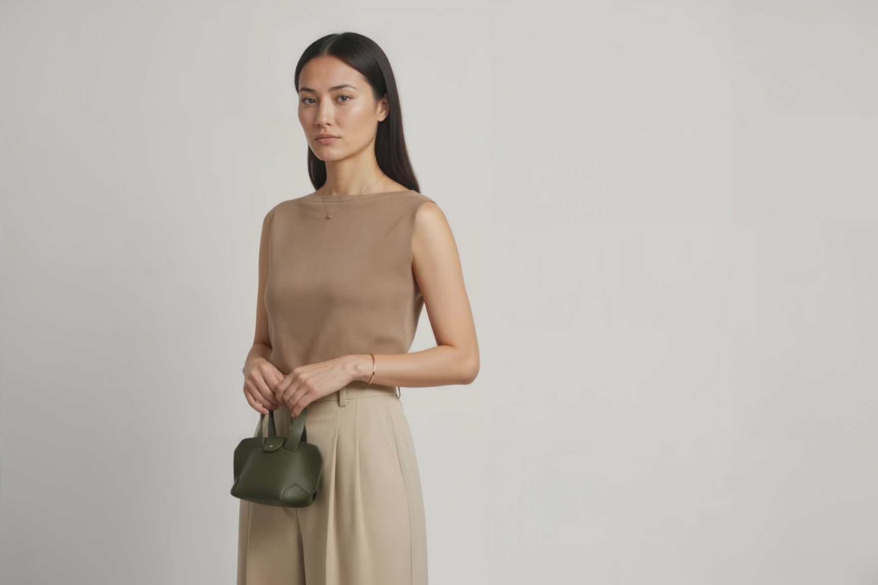 Nano Leather Tote Bag Olive Green Color On A Woman Model Premium Quality Minimalist Design Atelier Madre Manuel Dreesmann Barcelona Spain