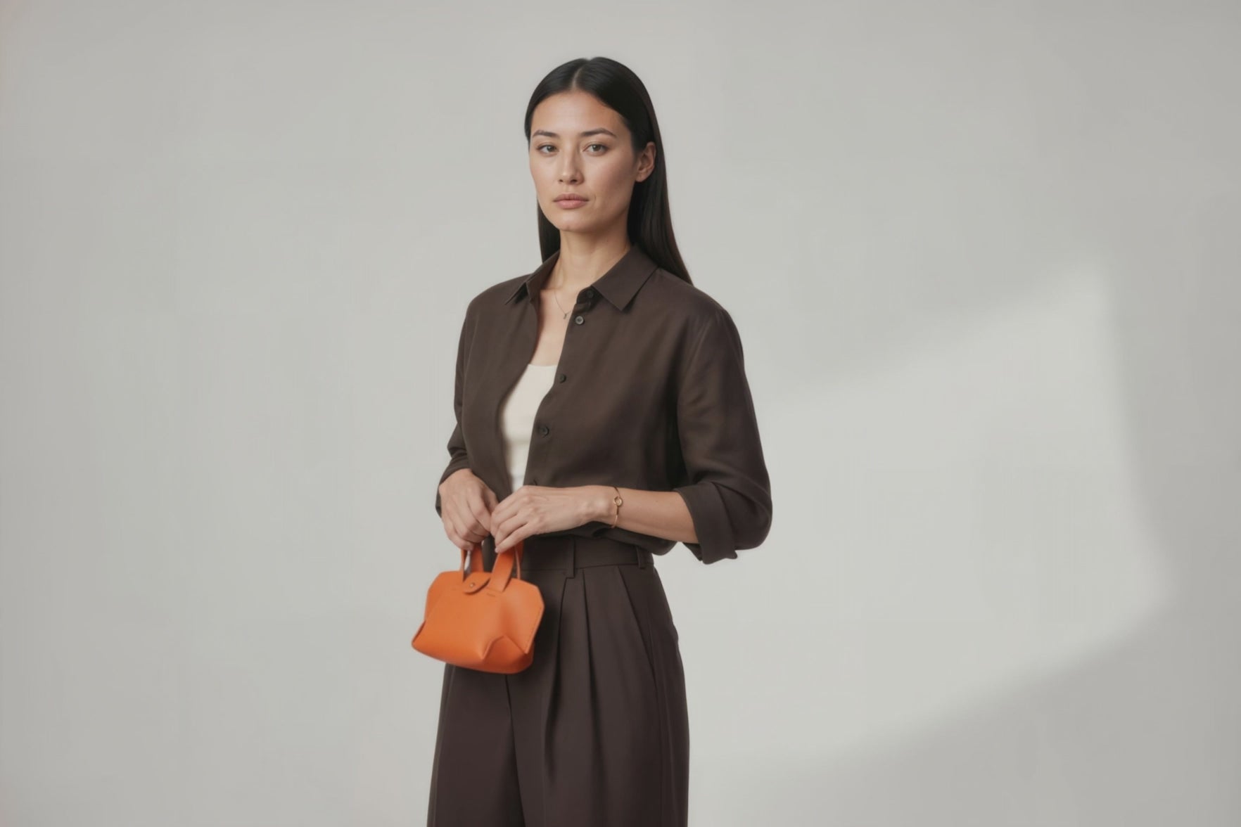 Nano Leather Tote Bag Orange Color On A Woman Model Premium Quality Minimalist Design Atelier Madre Manuel Dreesmann Barcelona Spain
