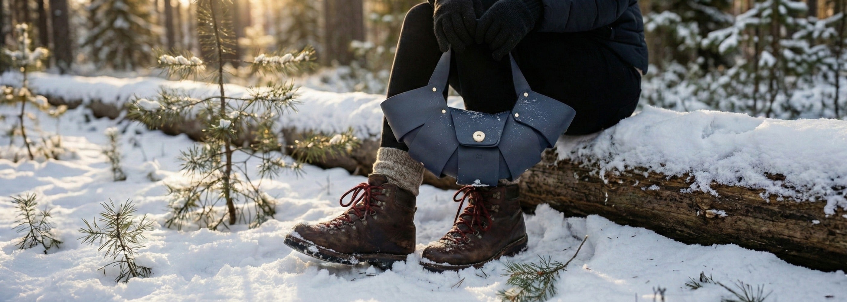 A woman wearing leather boots and leather bags ( Croissant Bag from Atelier Madre) , Winter Care Guide for Leather