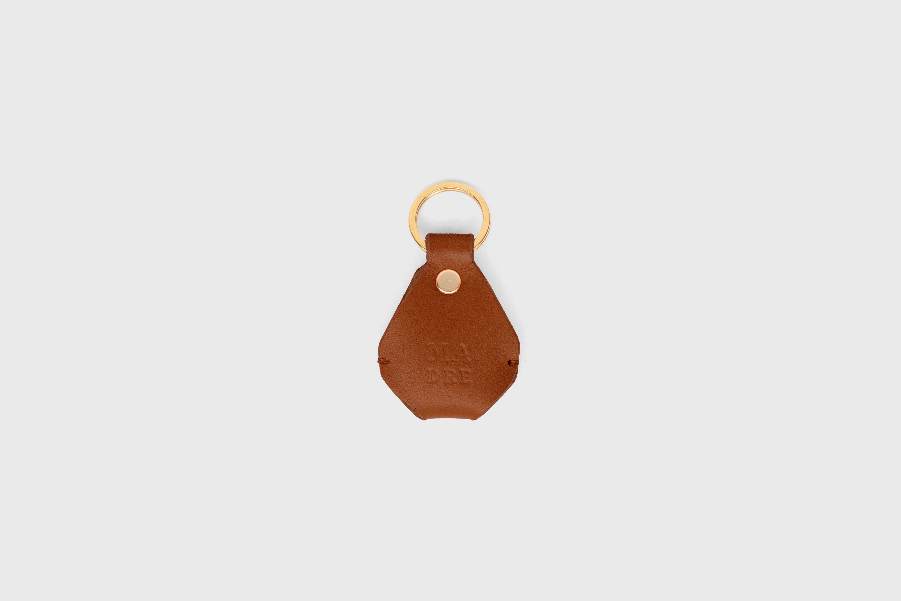 Airtag Key Ring In Dark Brown Color In Vegetable Tanned Leather Minimalistic Design Atelier Madre Manuel Dreesmann Barcelona Spain