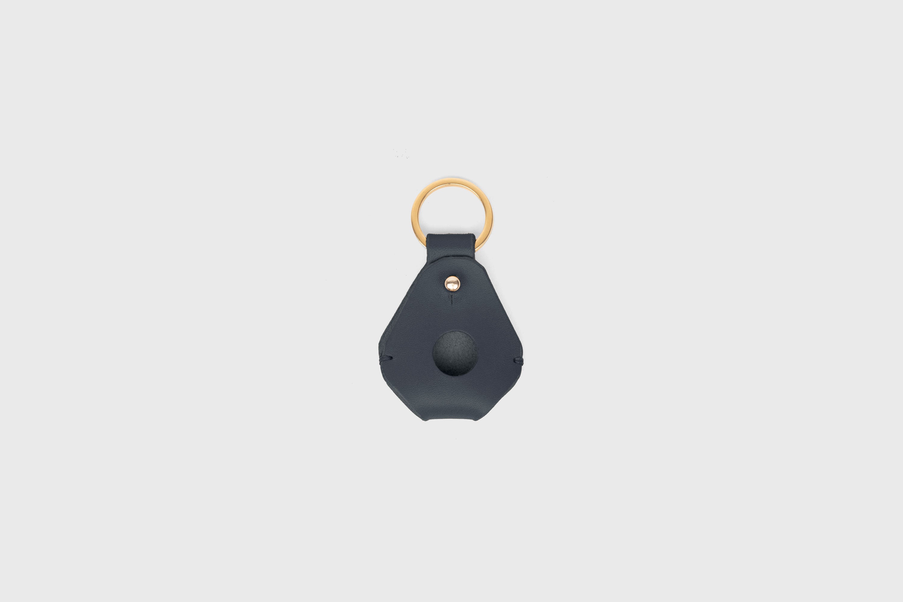 Airtag Key Ring In Marine Blue Color In Vegetable Tanned Leather Minimalistic Design Atelier Madre Manuel Dreesmann Barcelona Spain
