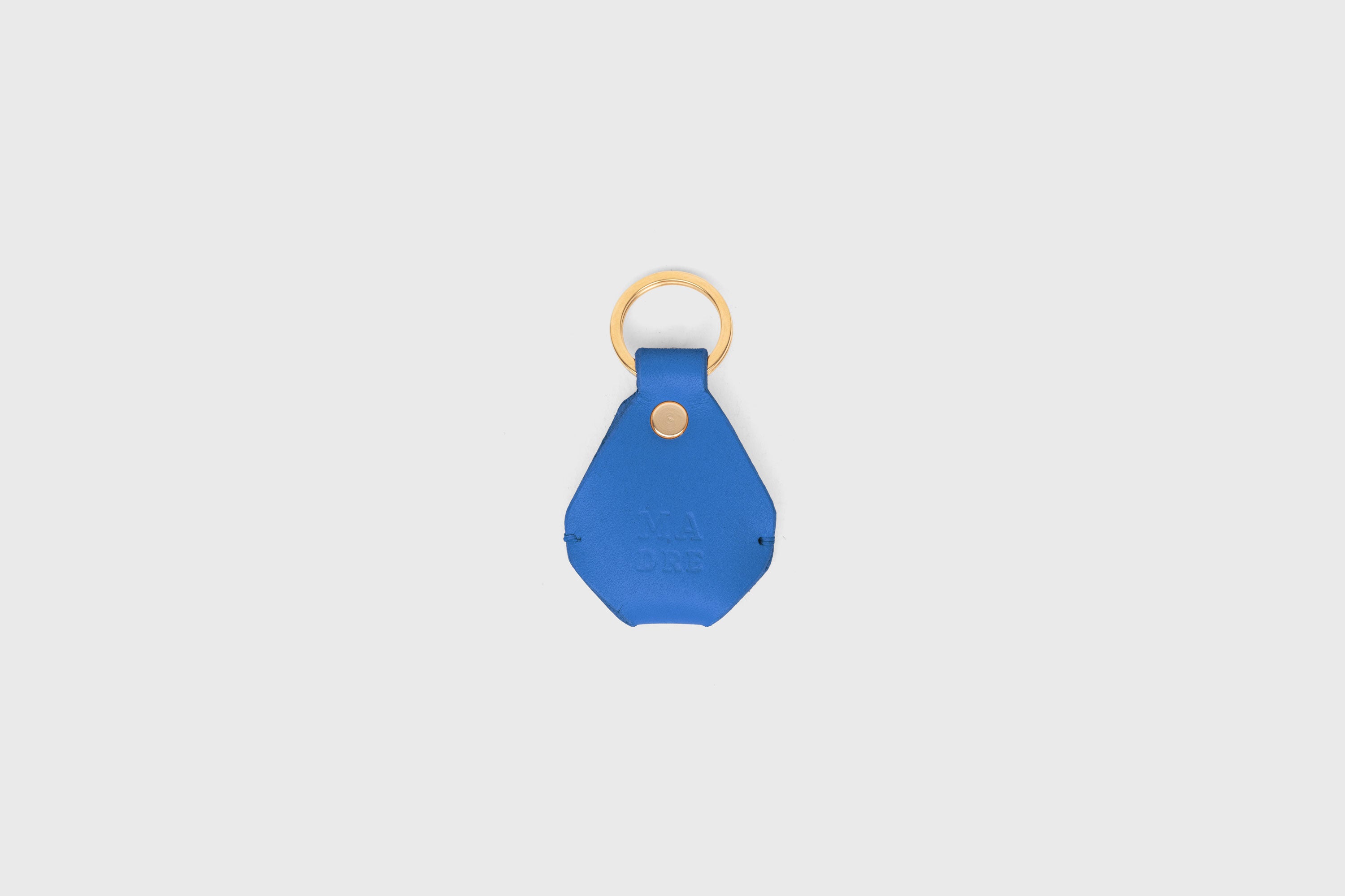 Airtag Key Ring In Royal Blue Color In Vegetable Tanned Leather Minimalistic Design Atelier Madre Manuel Dreesmann Barcelona Spain
