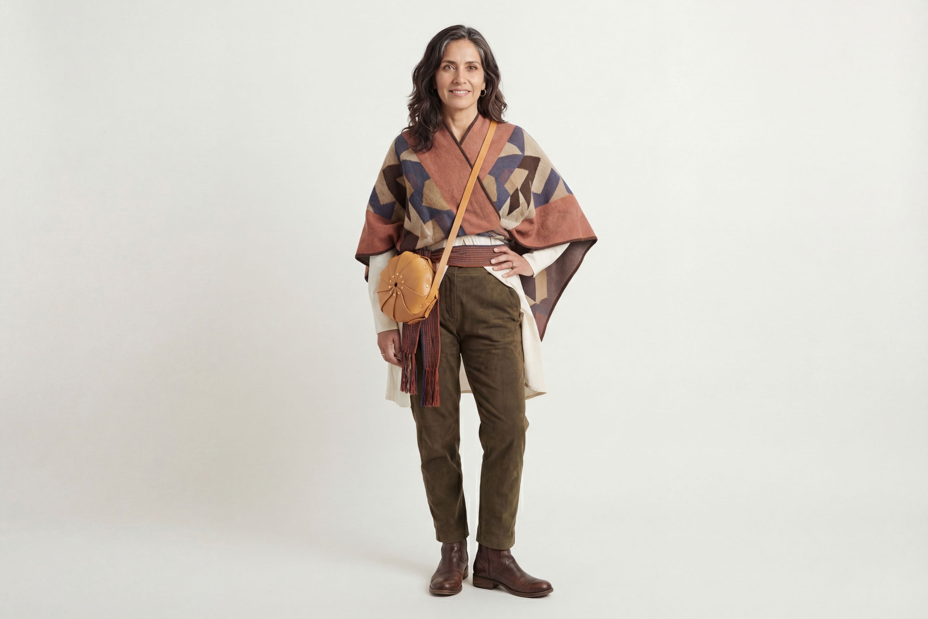 Anemo Leather Bag Brown Color On A Woman Model Floral Design Premium Minimalist Modern Circle Round Pouch Crossbody Atelier Madre Manuel Dreesmann Barcelona Spain