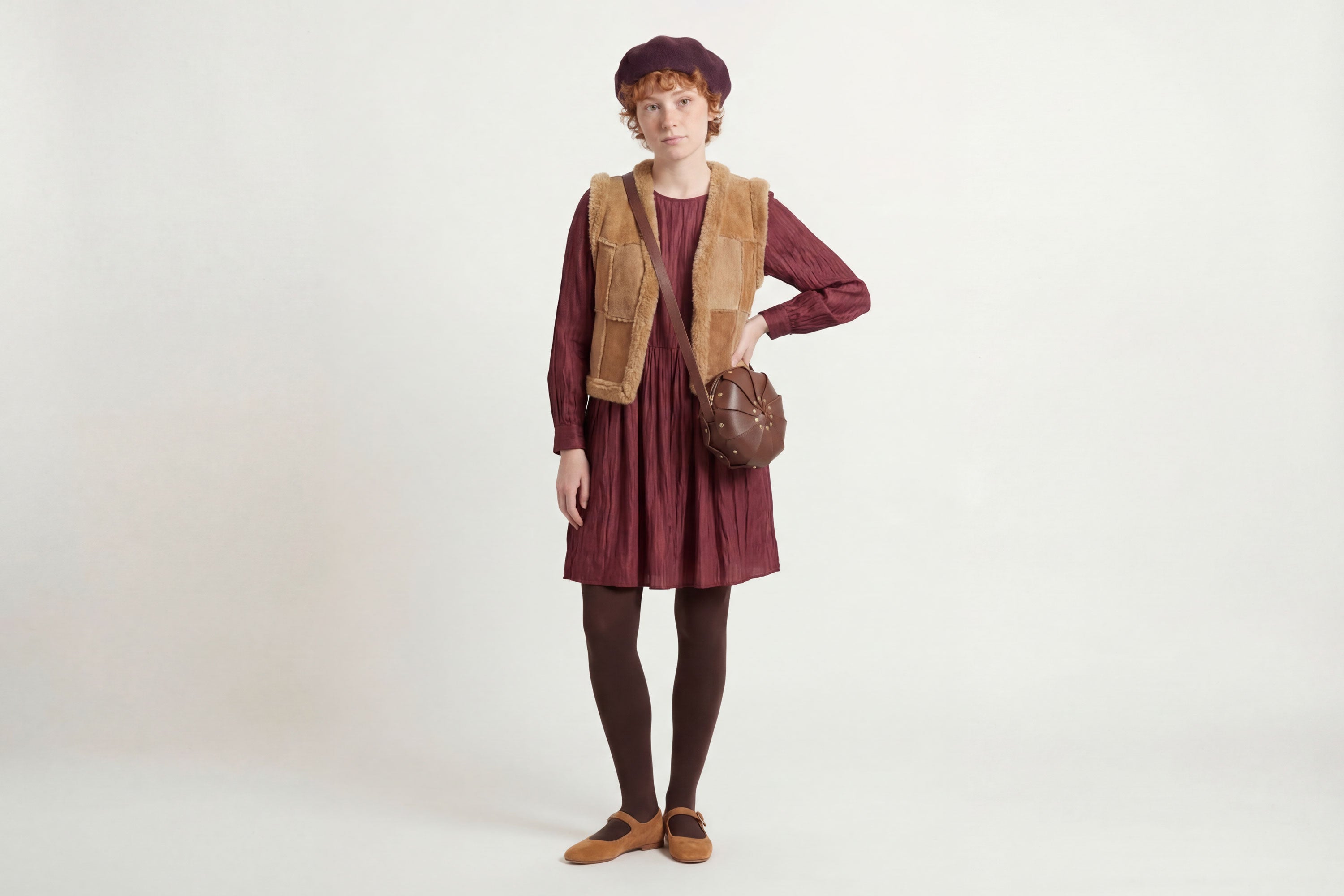 Anemo Leather Bag Dark Brown Color On A Woman Model Floral Design Premium Minimalist Modern Circle Round Pouch Crossbody Atelier Madre Manuel Dreesmann Barcelona Spain