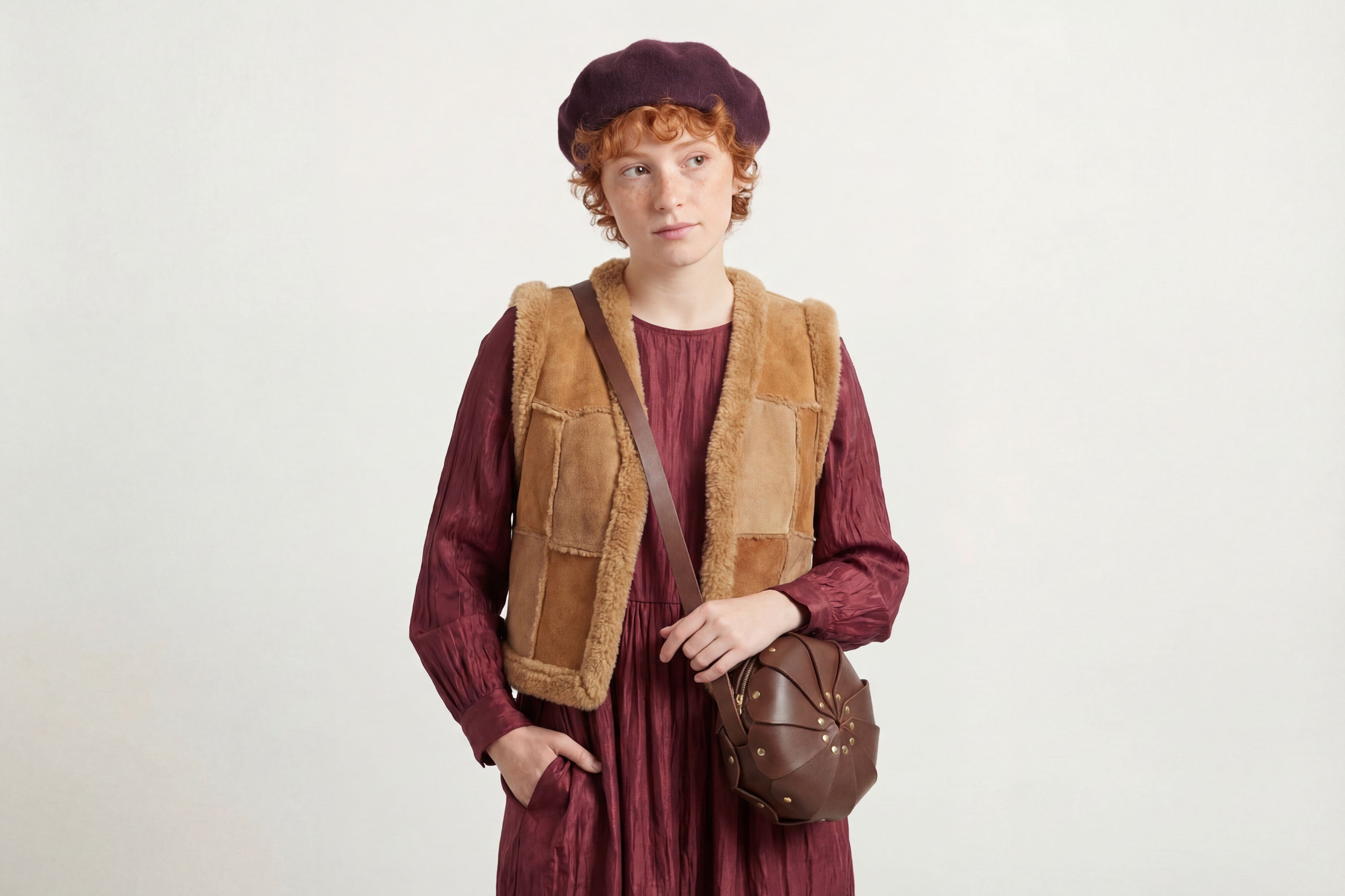 Anemo Leather Bag Dark Brown Color On A Woman Model Floral Design Premium Minimalist Modern Circle Round Pouch Crossbody Atelier Madre Manuel Dreesmann Barcelona Spain