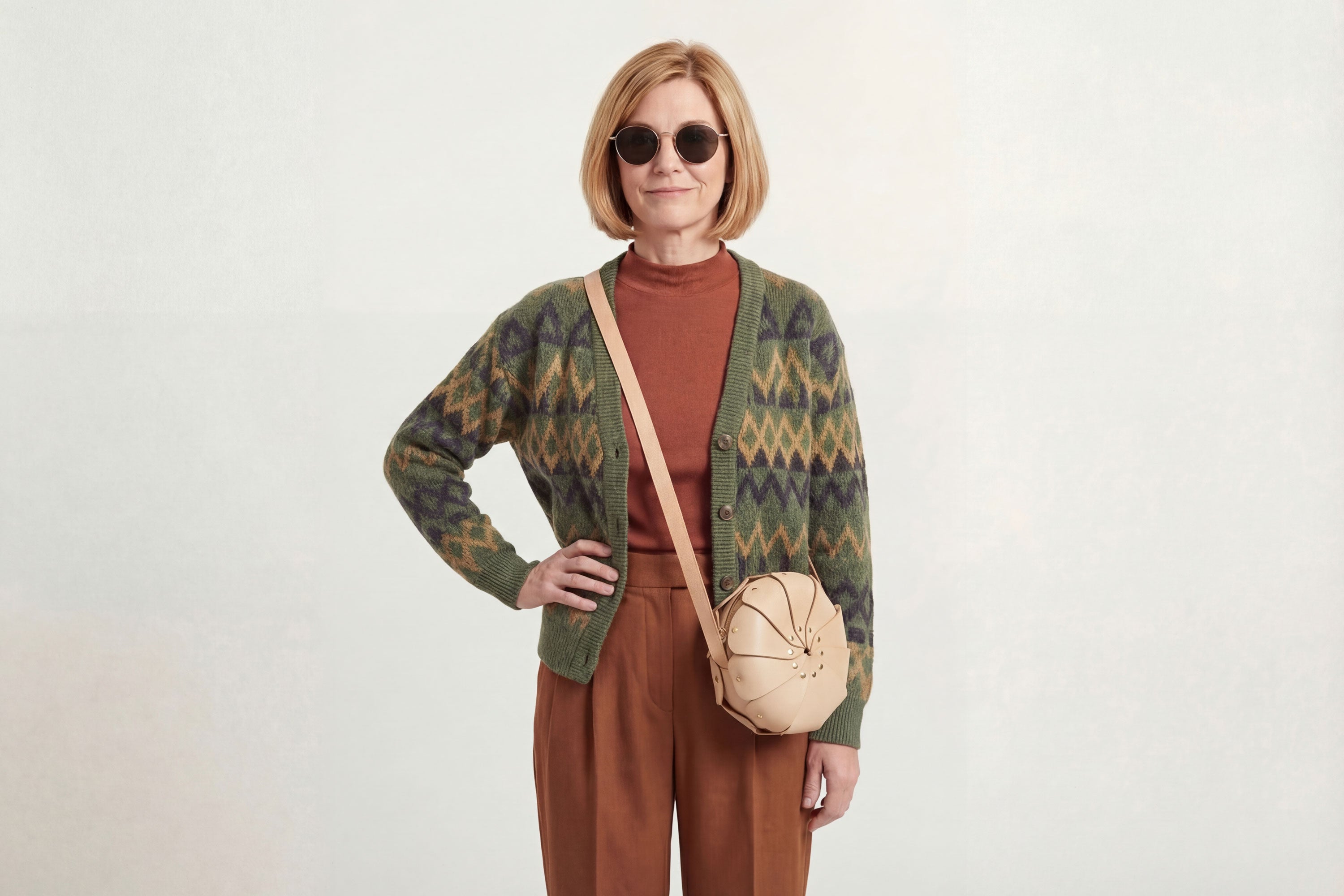 Anemo Leather Bag Natural Color On A Woman Model Floral Design Premium Minimalist Modern Circle Round Pouch Crossbody Atelier Madre Manuel Dreesmann Barcelona Spain