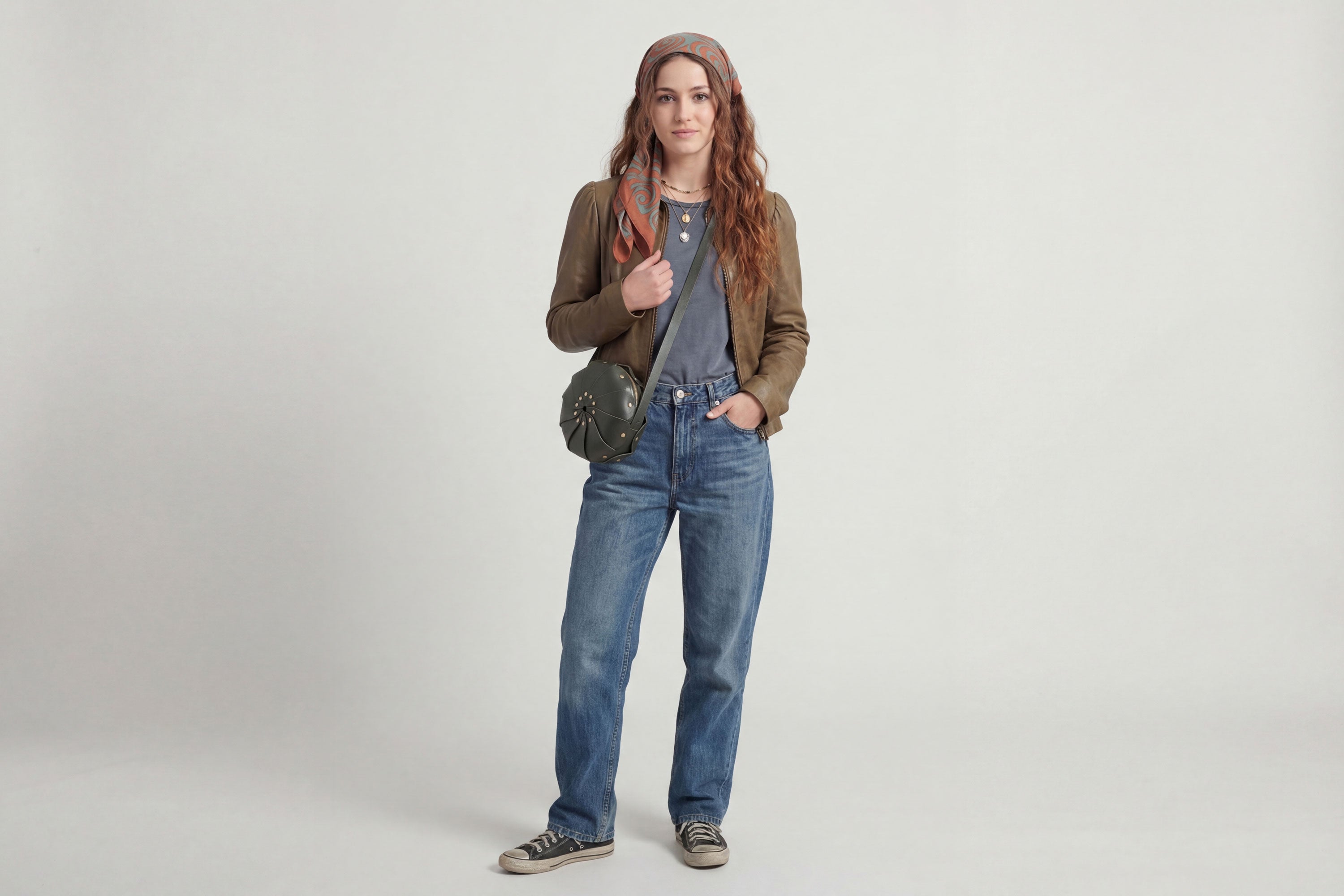 Anemo Leather Bag Olive Green Color On A Woman Model Floral Design Premium Minimalist Modern Circle Round Pouch Crossbody Atelier Madre Manuel Dreesmann Barcelona Spain