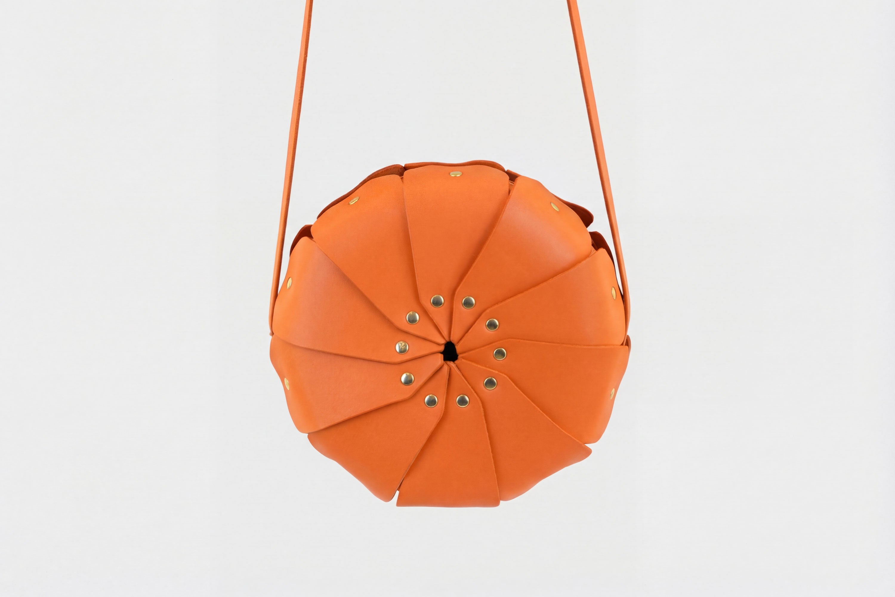Anemo Leather Bag Orange Color Floral Design Premium Minimalist Modern Circle Round Pouch Crossbody Atelier Madre Manuel Dreesmann Barcelona Spain