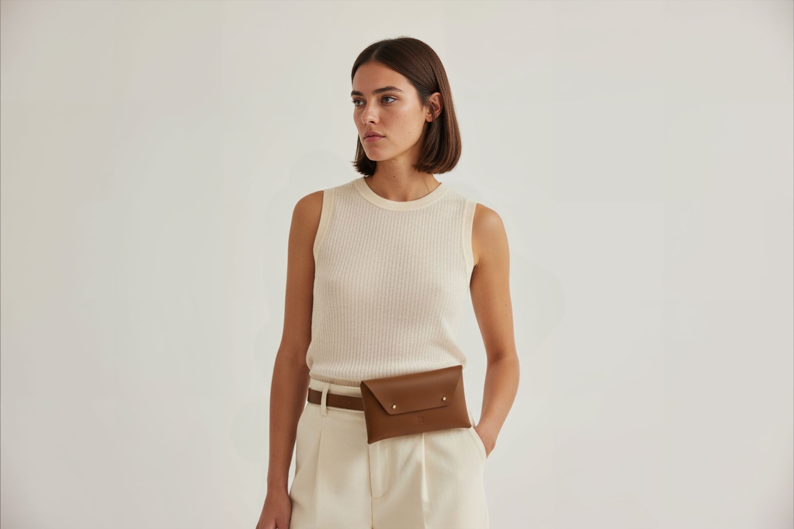 Belt Bag Leather Dark Brown Color On A Woman Model Fanny Pack Waist Bag Vegetable Tanned Leather Full Grain Premium Quality Modern Minimalist Design Atelier Madre Manuel Dreesmann Barcelona Spain