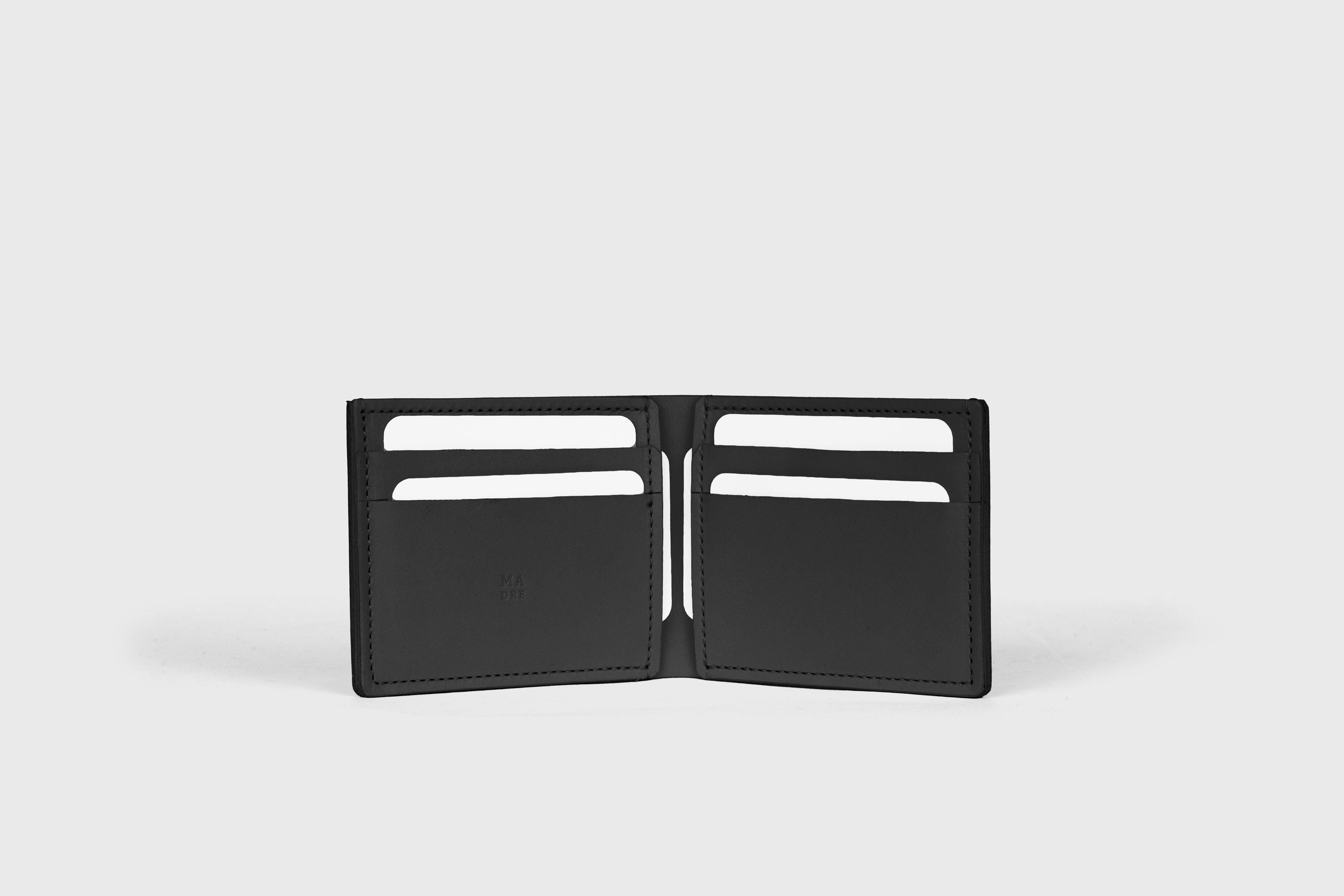 Bifold Wallet Horizontal With 6 Card Slots In Black Color In Vegetable Tanned Leather Minimalistic Design Atelier Madre Manuel Dreesmann Barcelona Spain