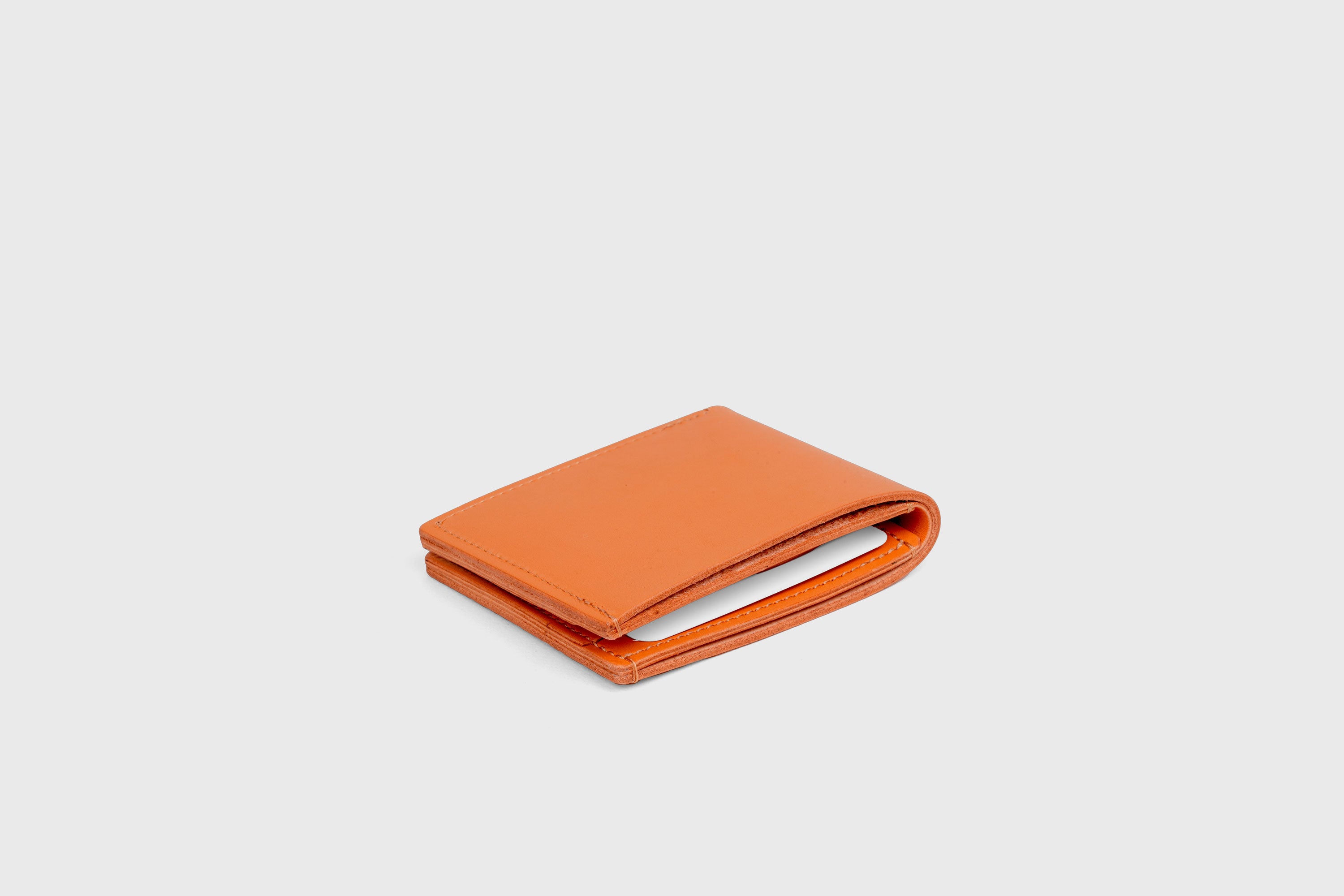 Bifold Wallet Horizontal With 6 Card Slots In Orange Color In Vegetable Tanned Leather Minimalistic Design Atelier Madre Manuel Dreesmann Barcelona Spain