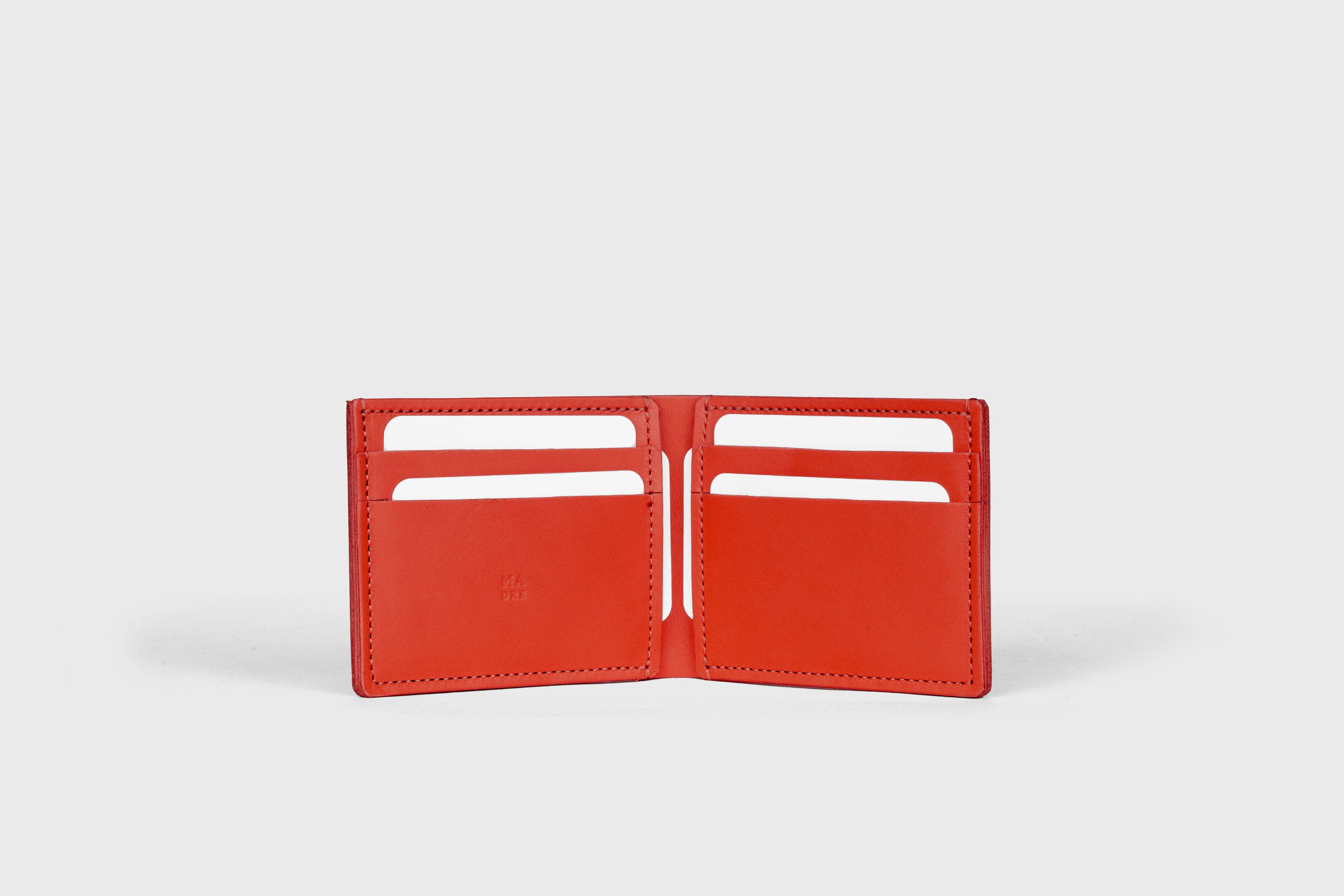 Bifold Wallet Horizontal With 6 Card Slots In Red Color In Vegetable Tanned Leather Minimalistic Design Atelier Madre Manuel Dreesmann Barcelona Spain