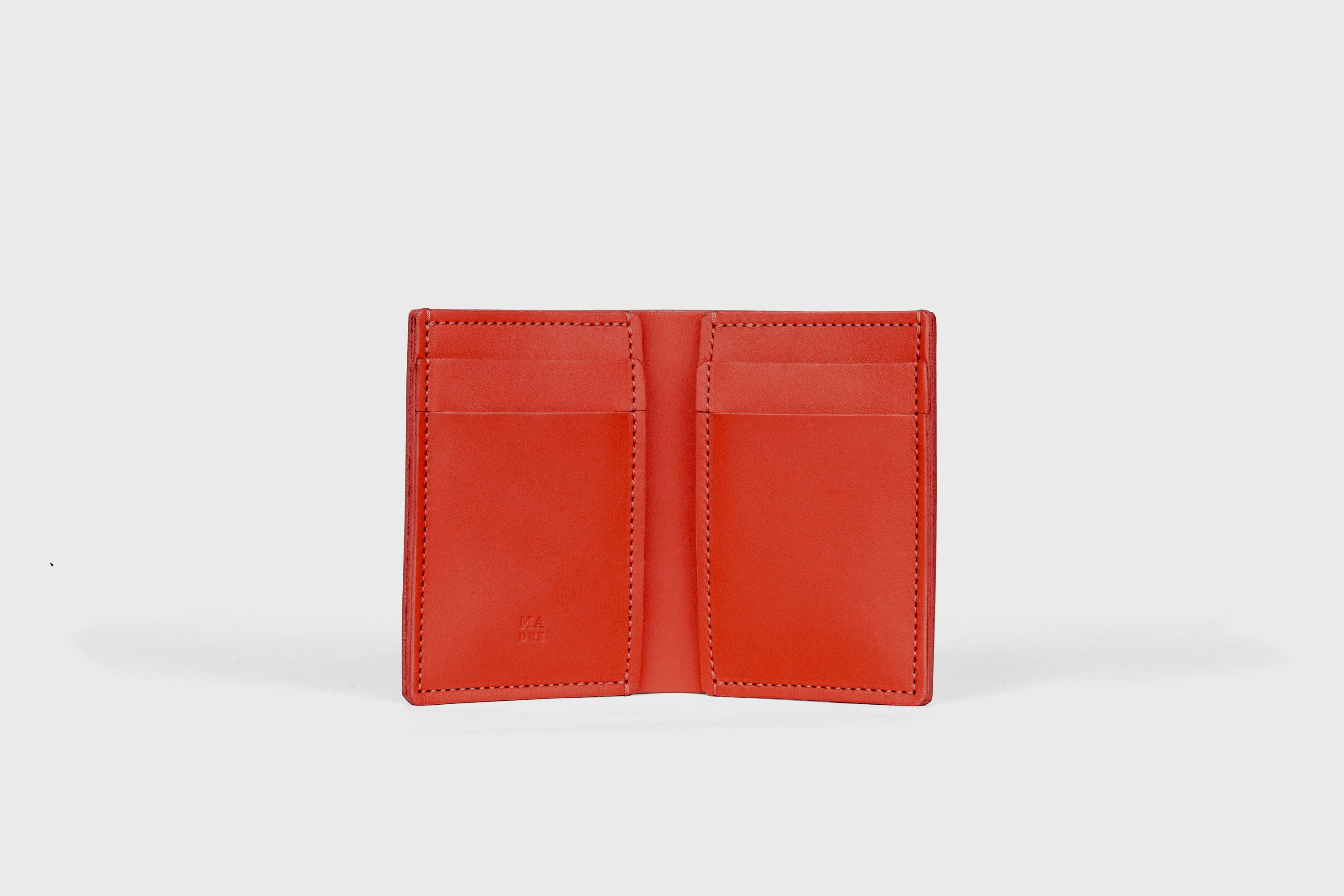Bifold Wallet Vertical 6 Slots In Red Color In Vegetable Tanned Leather Minimalistic Design Atelier Madre Manuel Dreesmann Barcelona Spain