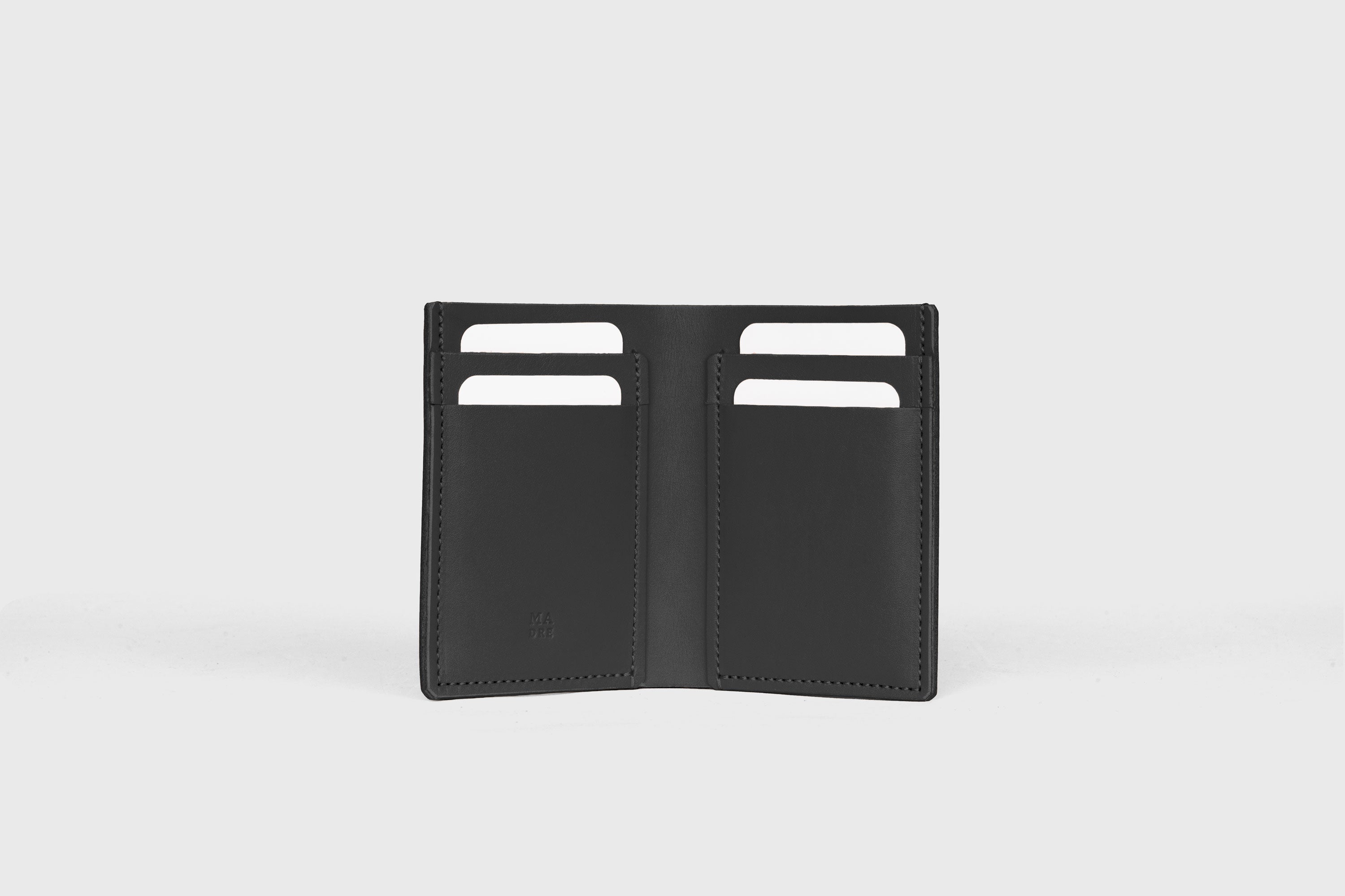 Bifold Wallet Vertical In Black Color In Vegetable Tanned Leather Minimalistic Slim Design Atelier Madre Manuel Dreesmann Barcelona Spain