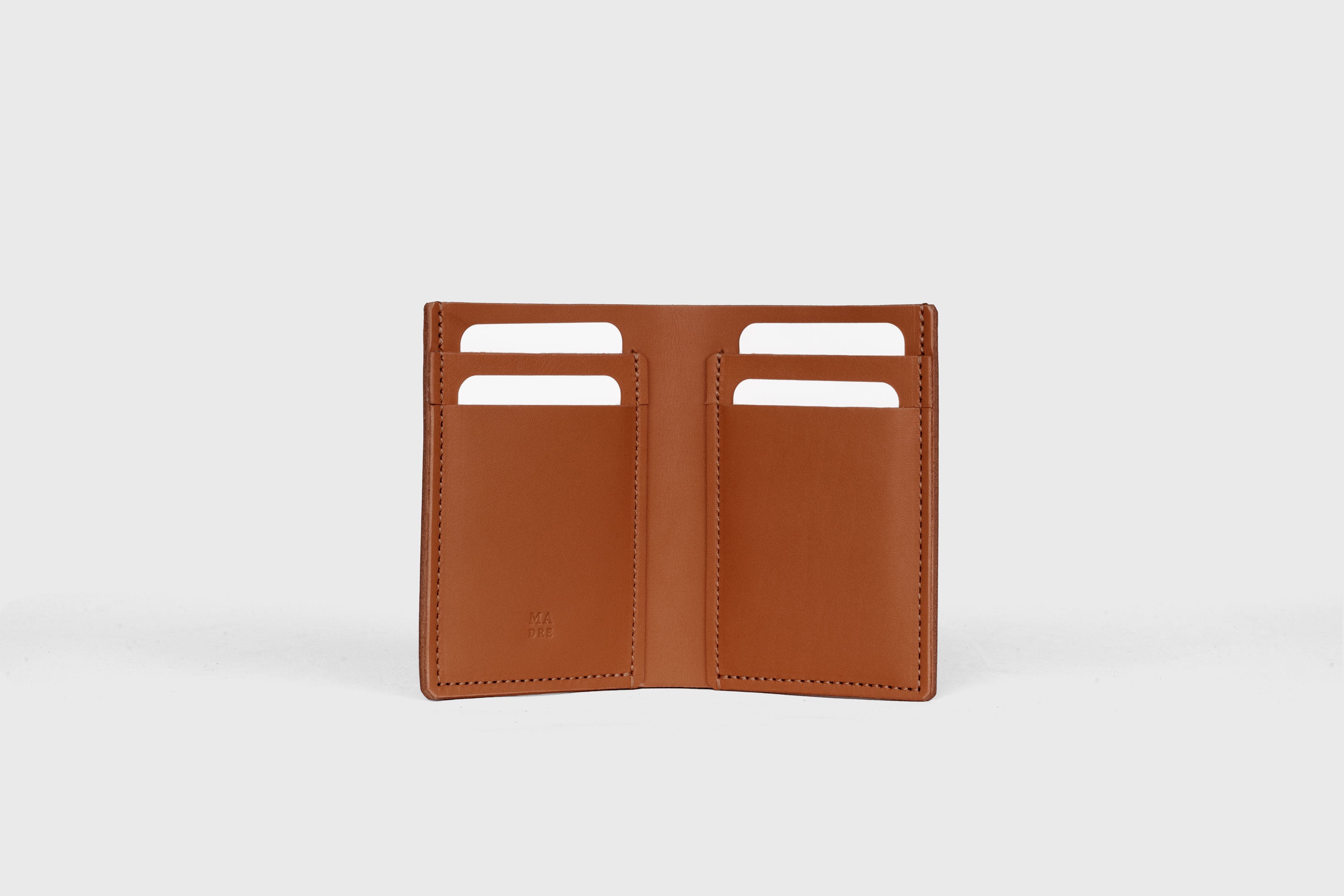 Bifold Wallet Vertical In Dark Brown Color In Vegetable Tanned Leather Minimalistic Slim Design Atelier Madre Manuel Dreesmann Barcelona Spain
